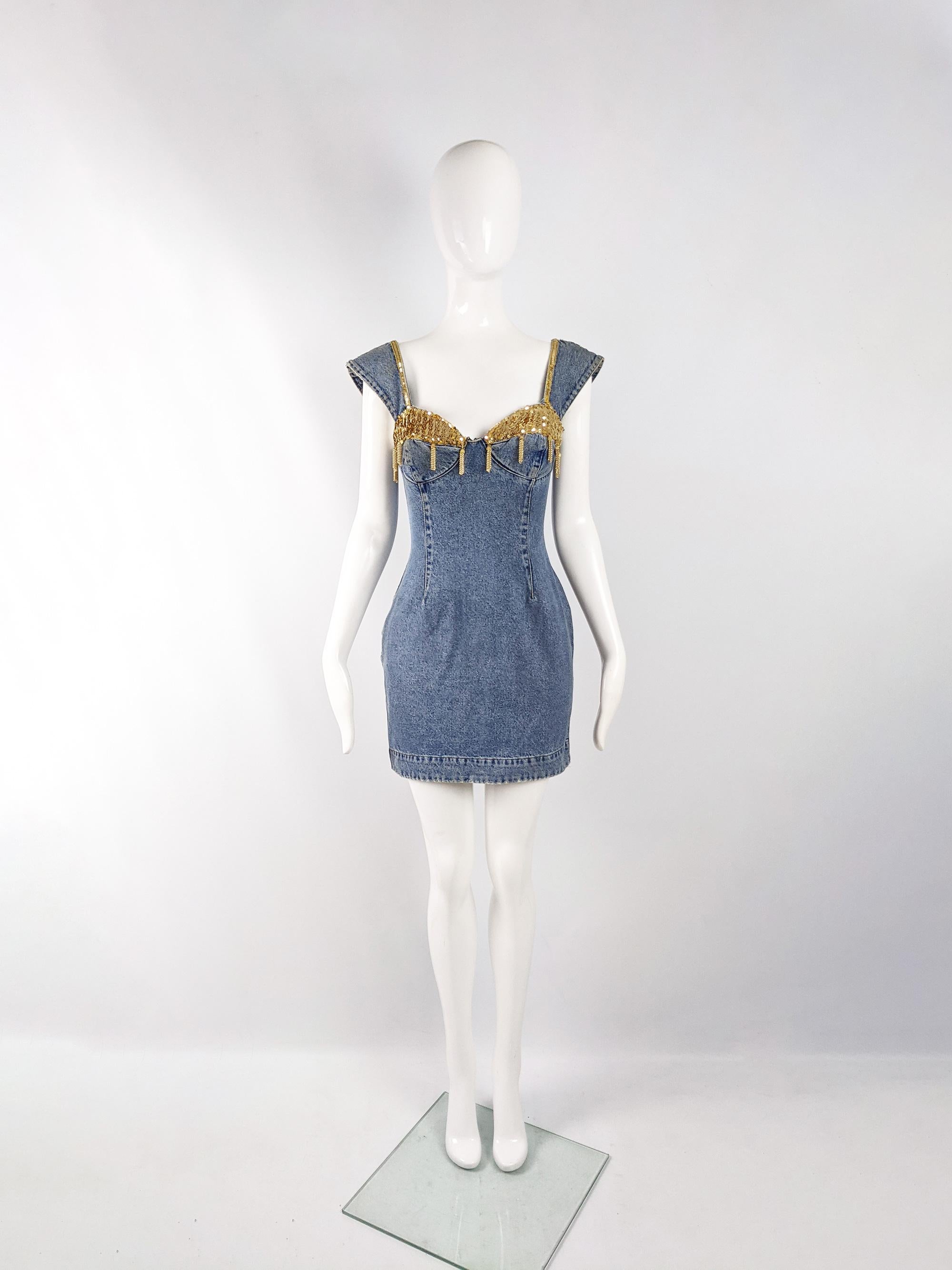 An amazing and rare vintage Katherine Hamnett sleeveless denim dress from the late 80s with intentionally distressed edges and fabulous fringed beading and sequins on the bust, creating an elevated punk / grunge look. 

Size: Marked vintage IT 42