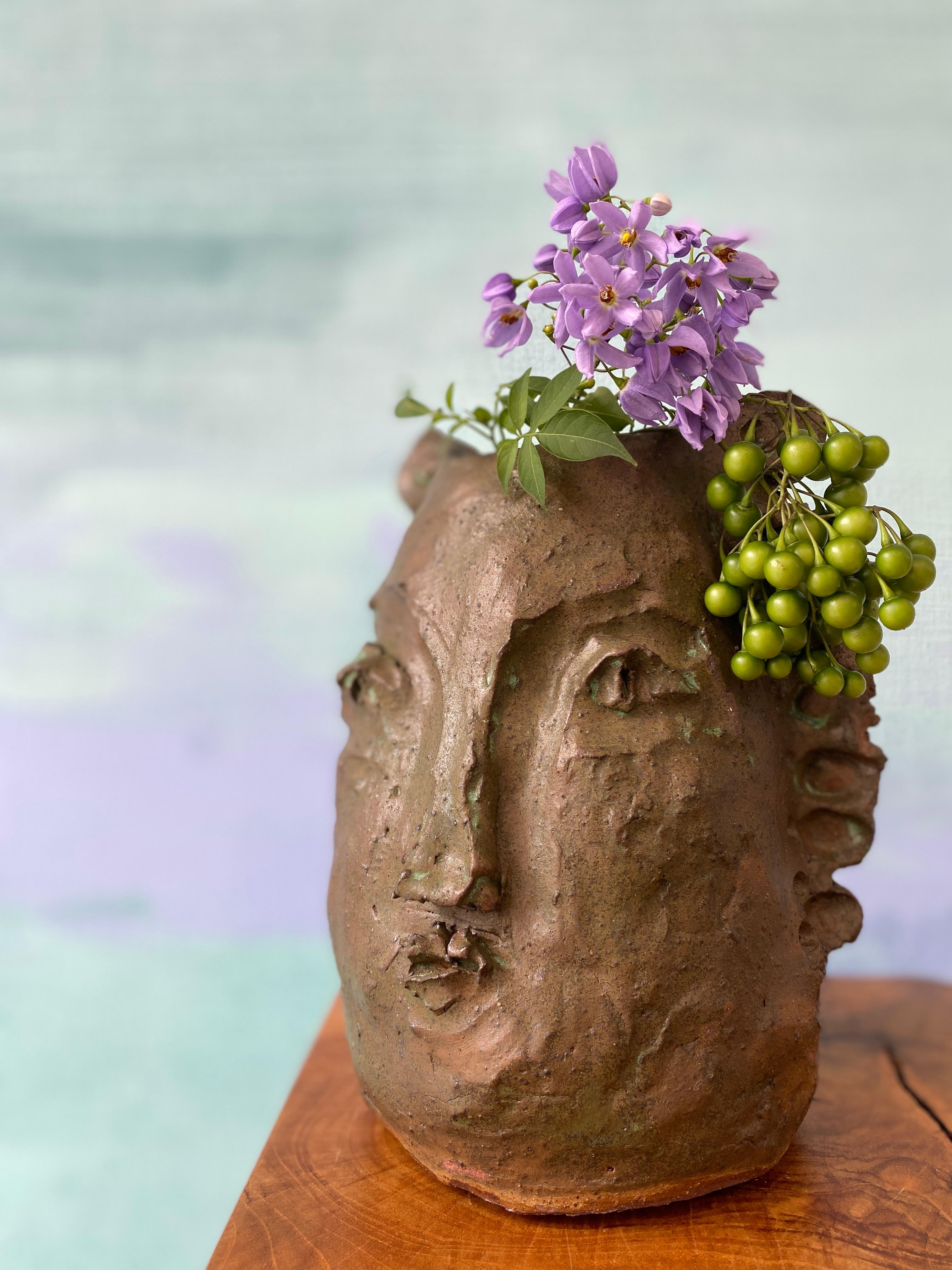 Wabi sabi beauty in imperfection, appreciate simplicity, handmade unique sculpture.

Elevate your space with this extraordinary exquisitely sculpted clay face and head vase creation that promises to captivate and inspire. Transform your home decor