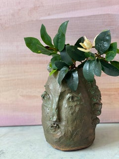 Tan green rustic wabi sabi hand sculpted glazed clay face vessel ancient head