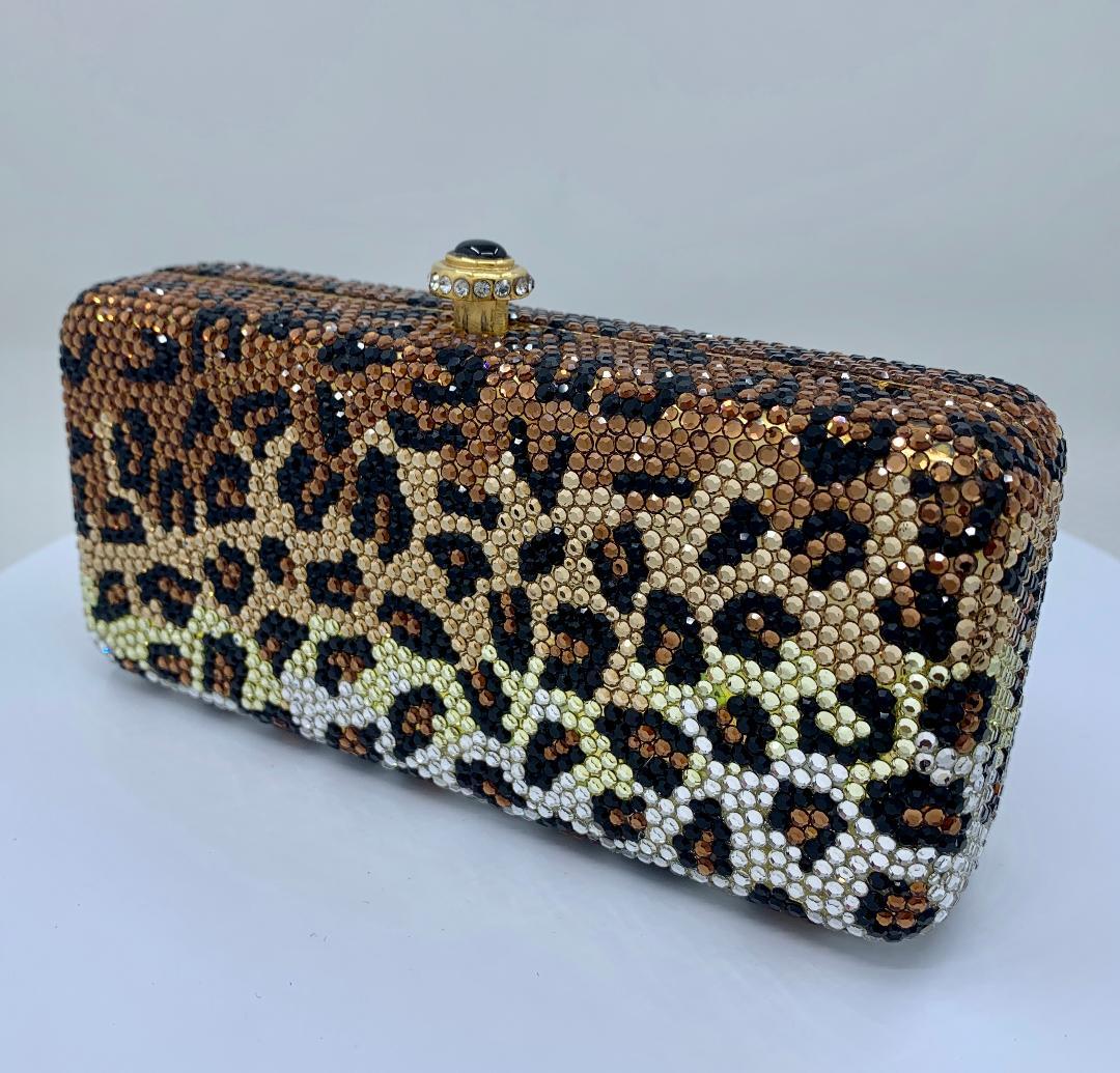 Exquisite handmade couture designer, Kathrine Baumann, who is the celebrated handbag maker to the stars, leopard pattern minaudière, evening bag or evening clutch is completely covered in fine quality Swarovski crystals. Gold toned metal frame with