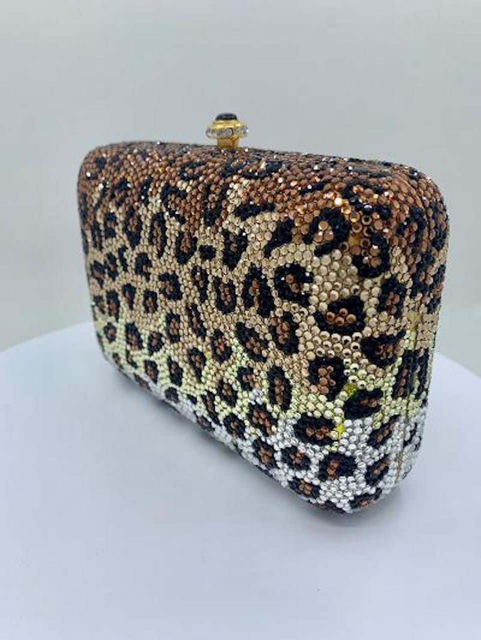 Exquisite handmade designer, Kathrine Baumann, who is the celebrated handbag maker to the stars, leopard pattern pillow shaped minaudière, evening bag or evening clutch is completely covered in fine quality Swarovski crystals. Gold toned metal frame