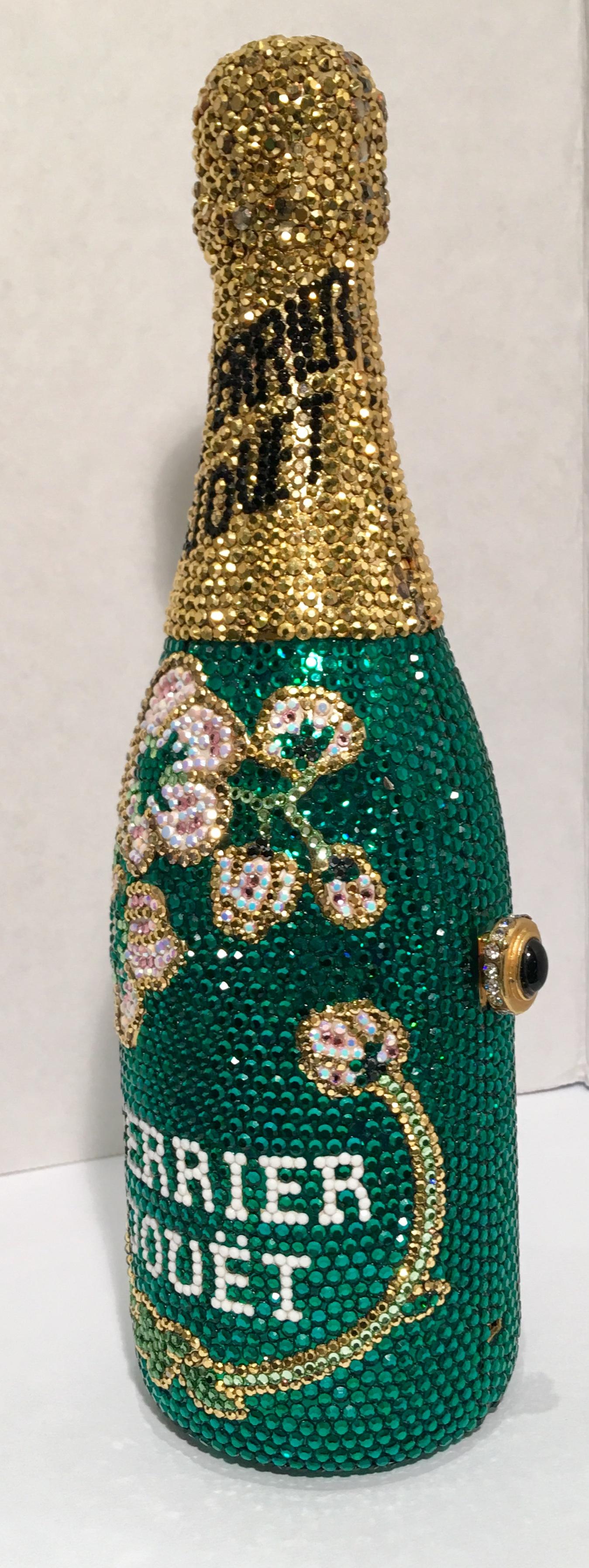 A limited-edition, signed and numbered, Swarovski crystal encrusted, gold-plated metal Perrier Jouet (Trademarked) French champagne split bottle shaped minaudière evening bag purse by Kathrine Baumann, who is the celebrated handbag maker to the