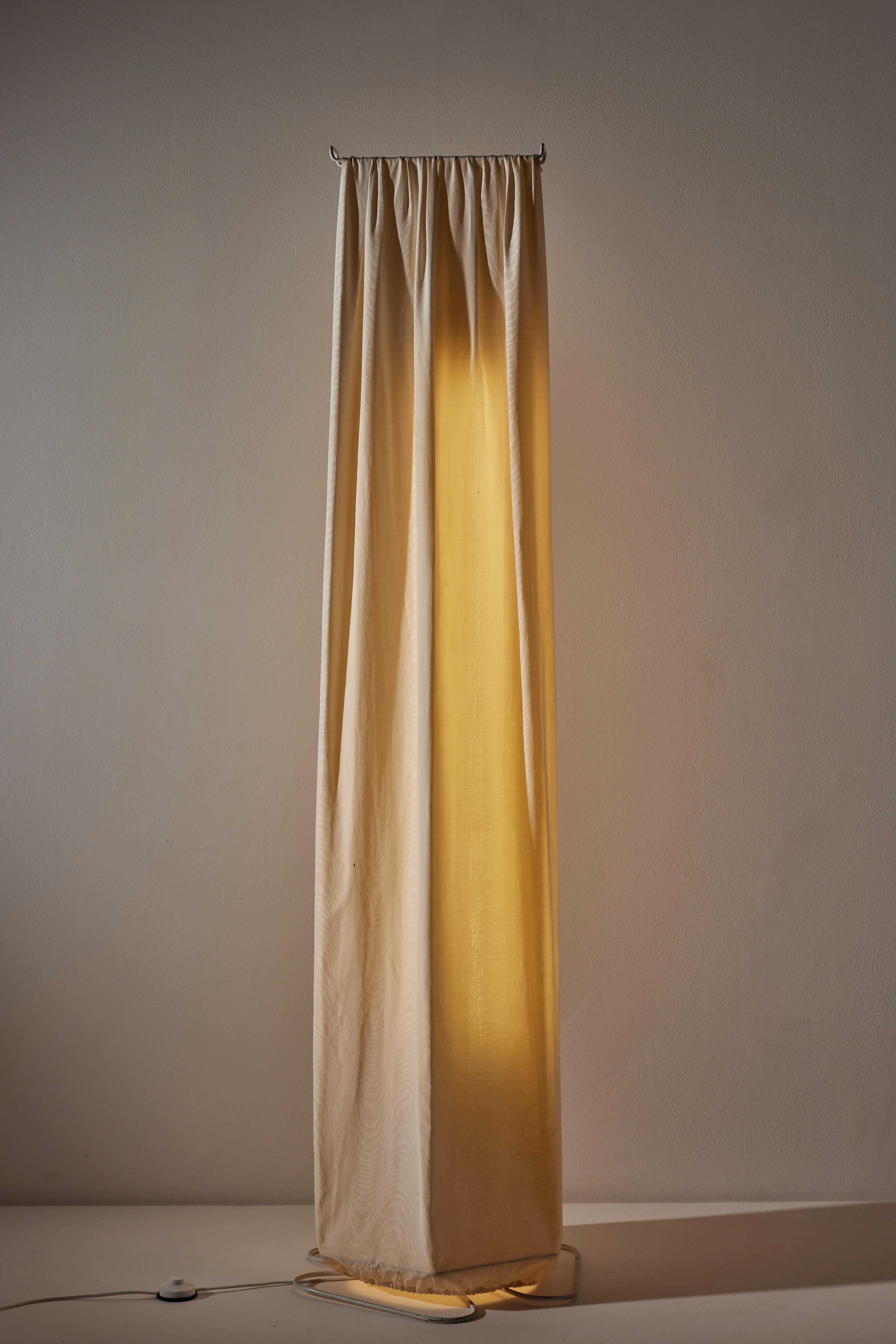 Katia floor lamp by Tobia Scarpa for Flos. Designed and manufactured in Italy, circa 1970's. Lacquered metal structure with fabric diffuser. Original European cord. We recommend two fluorescent 120v bulbs. Bulbs provided as a one time courtesy.