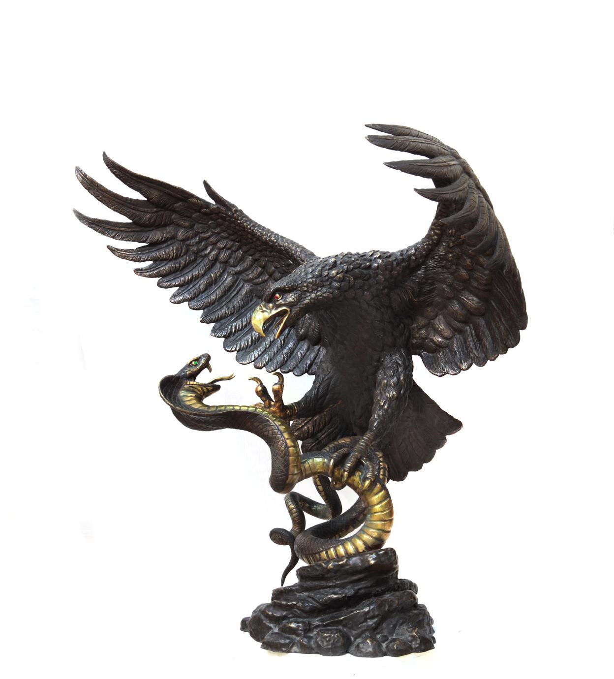 This sculptural work depicts a dramatic scene of a struggle between a mighty eagle and a snake. The eagle, a symbol of strength, courage and victory, has spread its wings wide, demonstrating its power and determination. Its beak is open in a