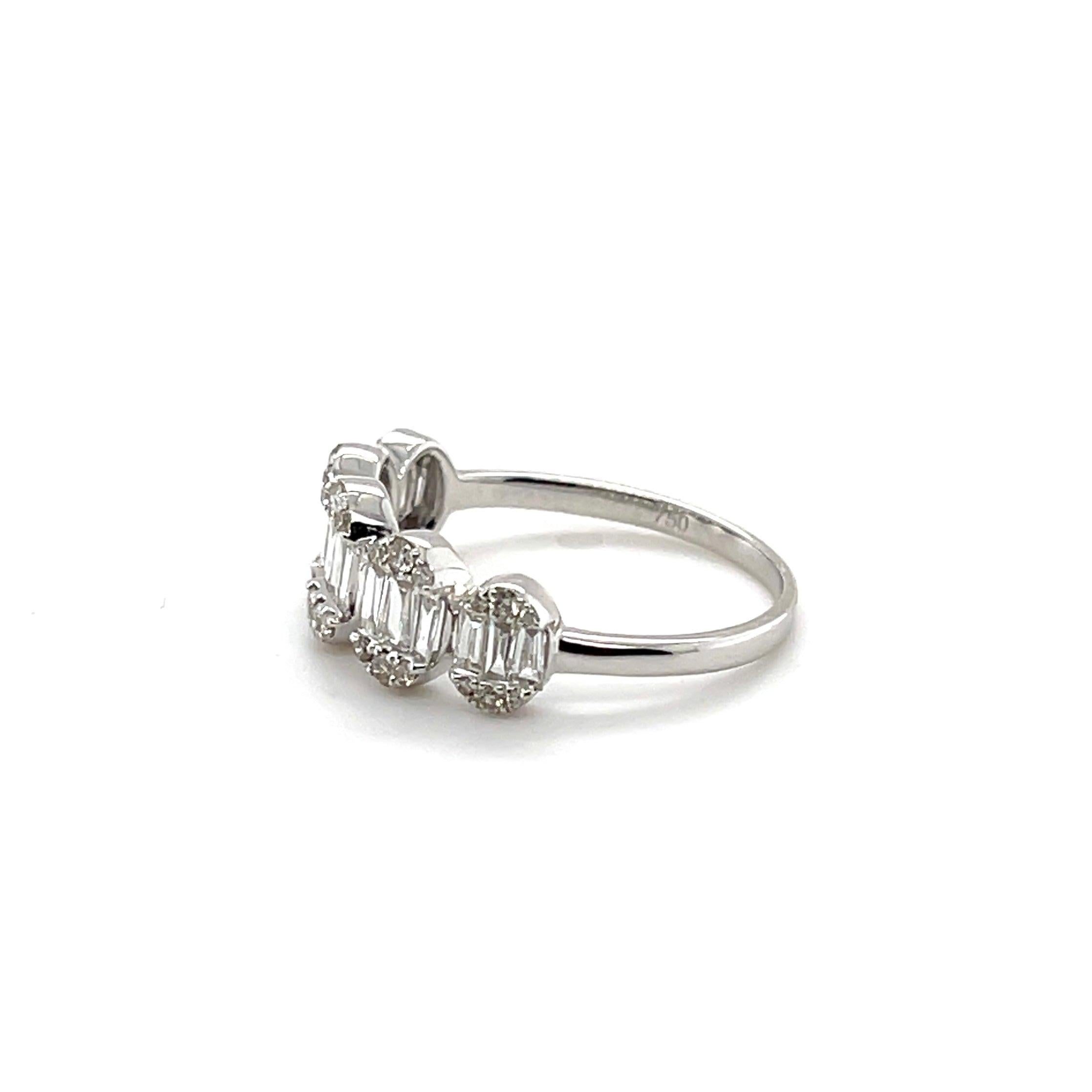 Diamonds, crafted with eighteen karat white gold, complemented by a beautiful polished finish design.

30 Round diamond weight: 0.18CT

15 Tapered diamond baguette weight: 0.29CT 

Item weight: 1.87G 

18KWG 

Complimentary resizing upon purchase!