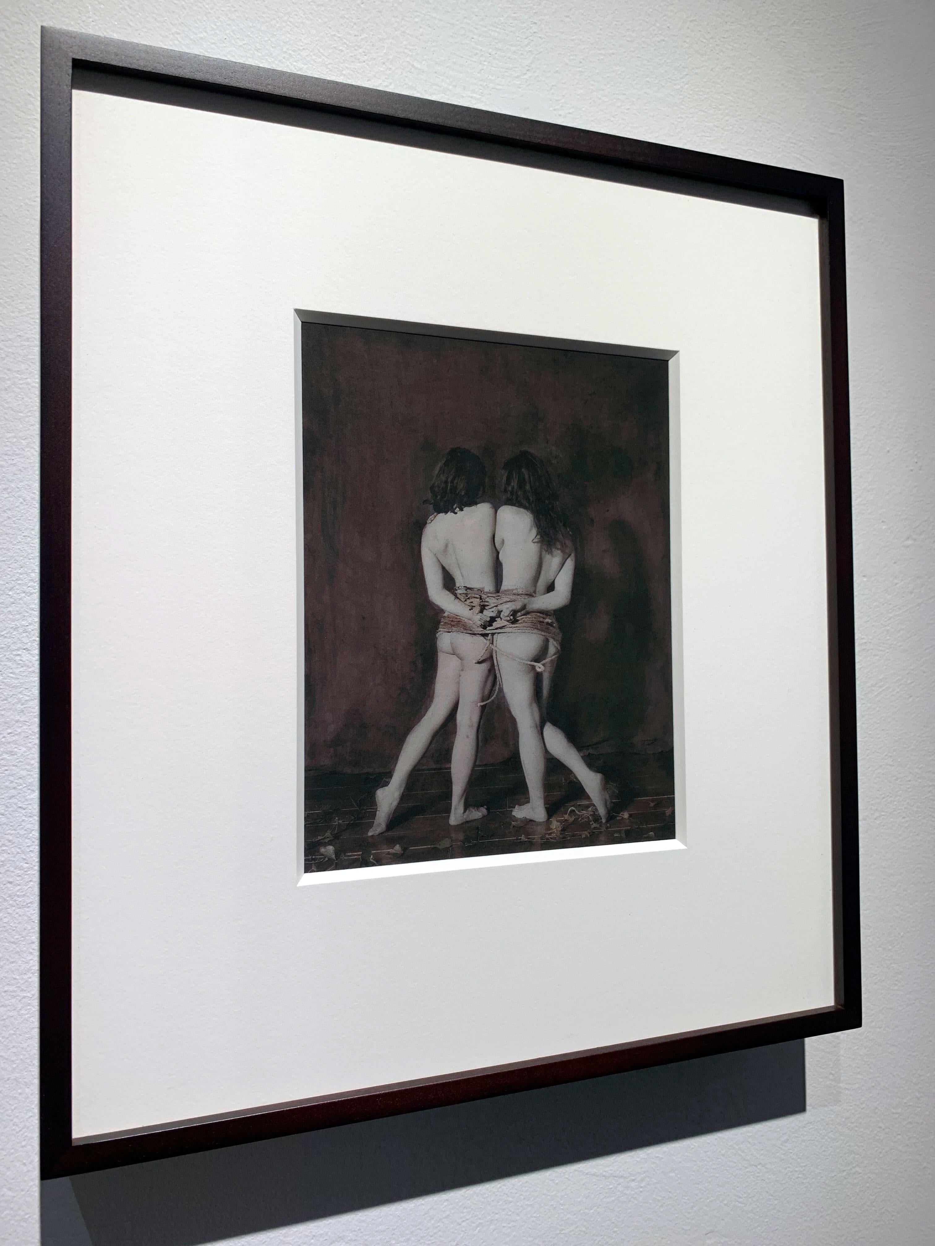 Pigment Print of hand colour photograph depicting nude females tight with rope - Black Nude Photograph by Katie Eleanor