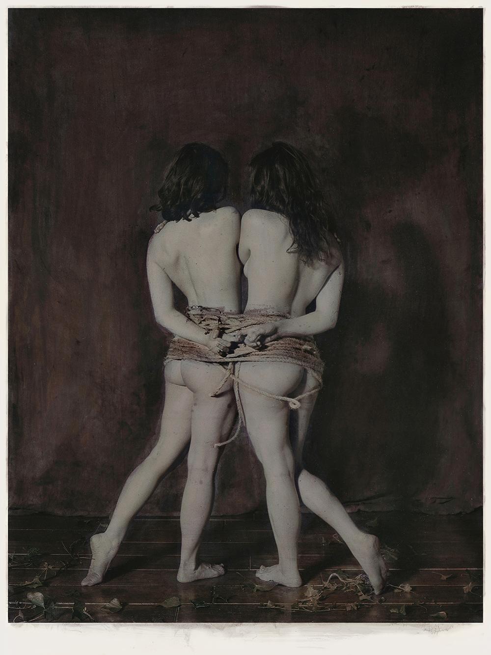 Pigment Print of hand colour photograph depicting nude females tight with rope