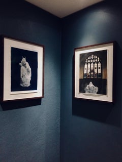 Portrait of a devil creature immobilised in marble -Hand coloured print in blue