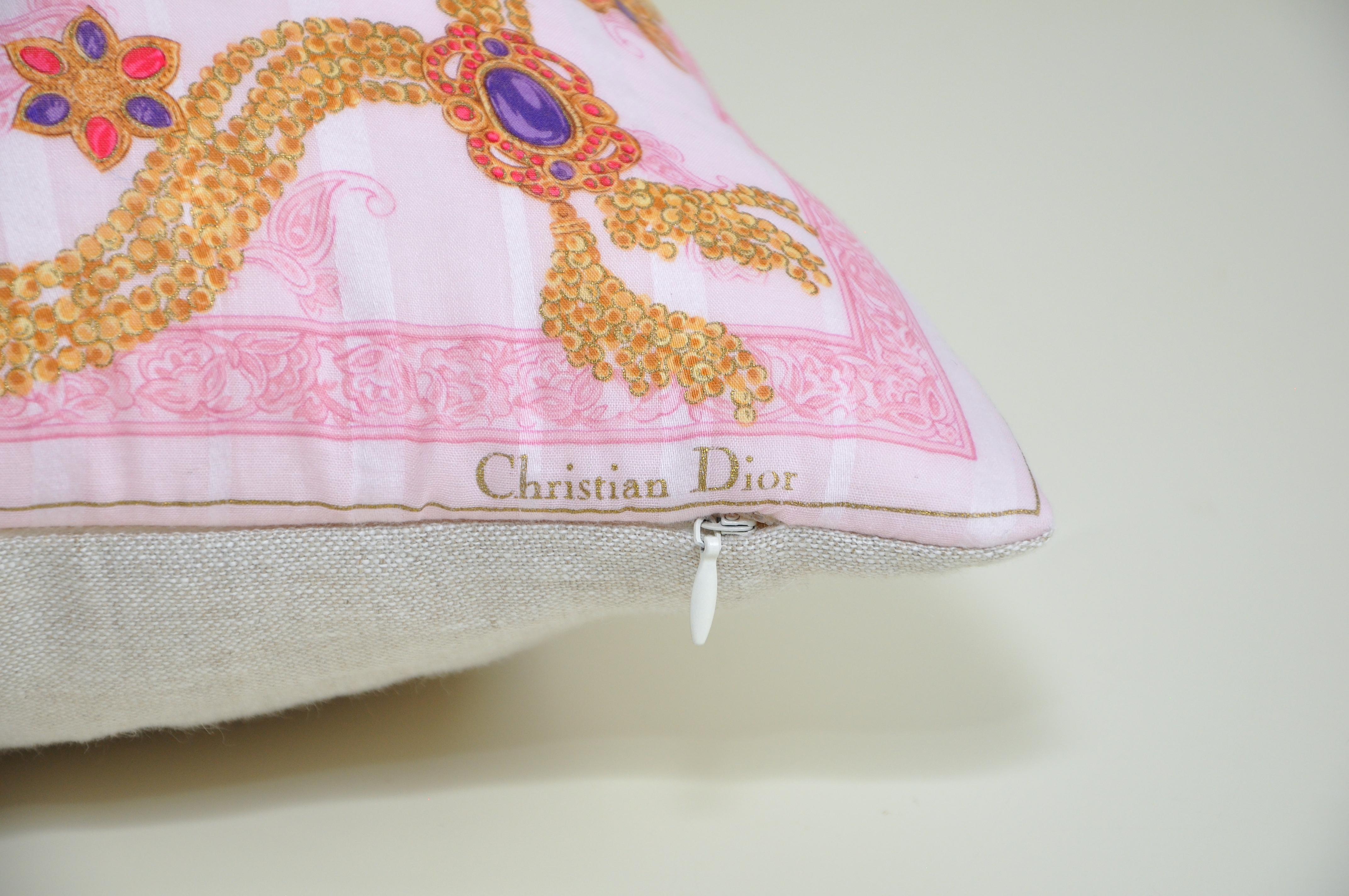 Title:
Katie Larmour vintage Christian Dior scarf backed in pure Irish Linen cushion pillow pink gold

This gem is a one-of-a-kind custom made luxury cushion (pillow) from an exquisite vintage Christian Dior fashion scarf in a very unique and