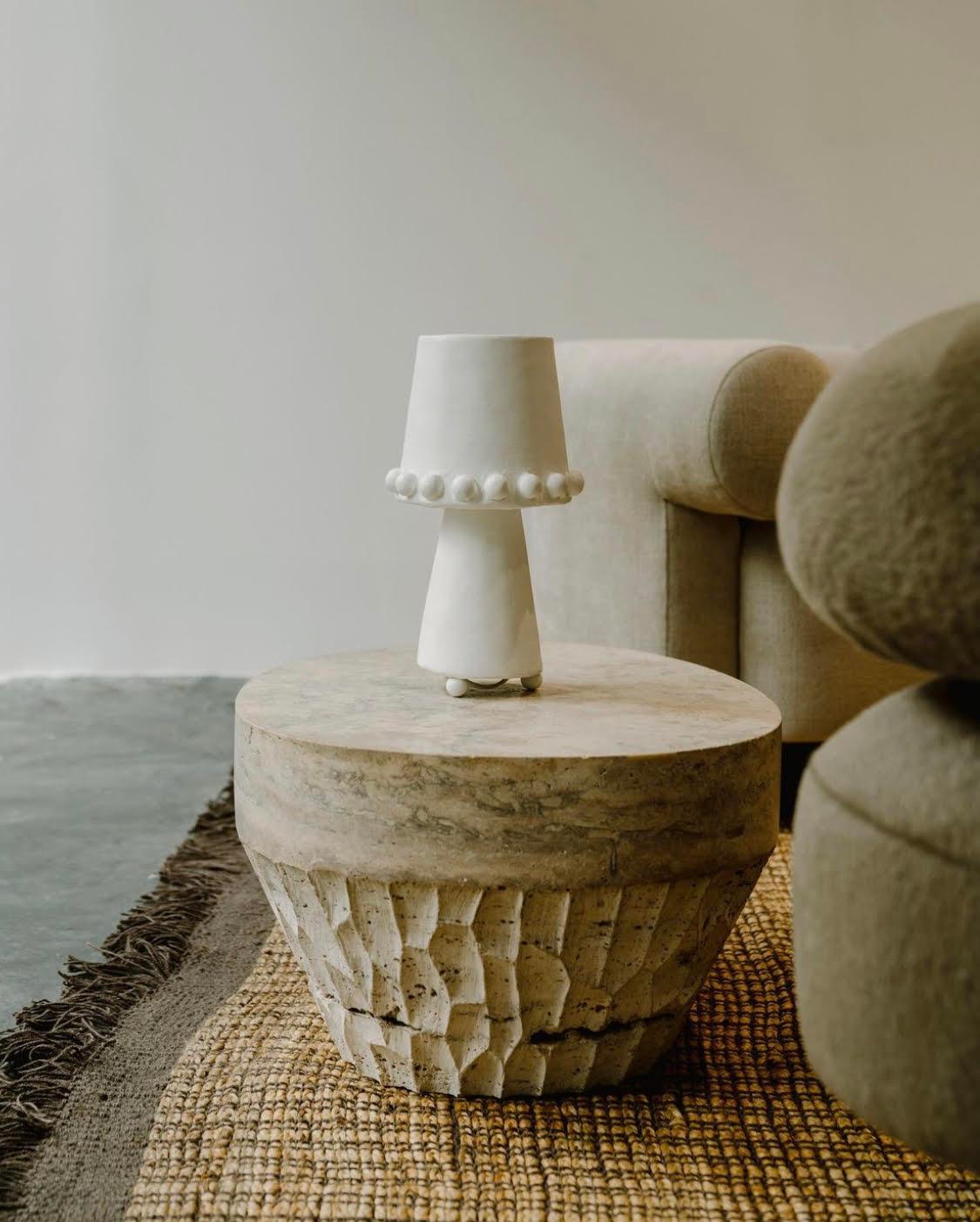 A more petite version of the Rachel, the Katie Table Lamp exudes a versatile style that is both artisanal and playful. The light is diffused evenly across the sanded plaster, left raw to allow the light to highlight its natural imperfections. This