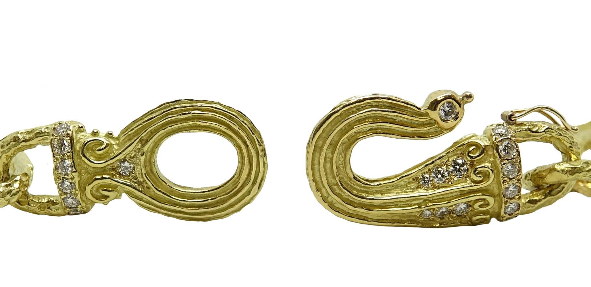  This Classic Katy Briscoe 14mm Oval Link Necklace is 18K Yellow Gold. A Large Dana Clasp Adds An Elegant Feel To This Necklace. Diamonds Are Set Into The Clasp Adding A Little Extra Sparkle. These Diamonds Weigh A Total Carat Weight Of 2.09