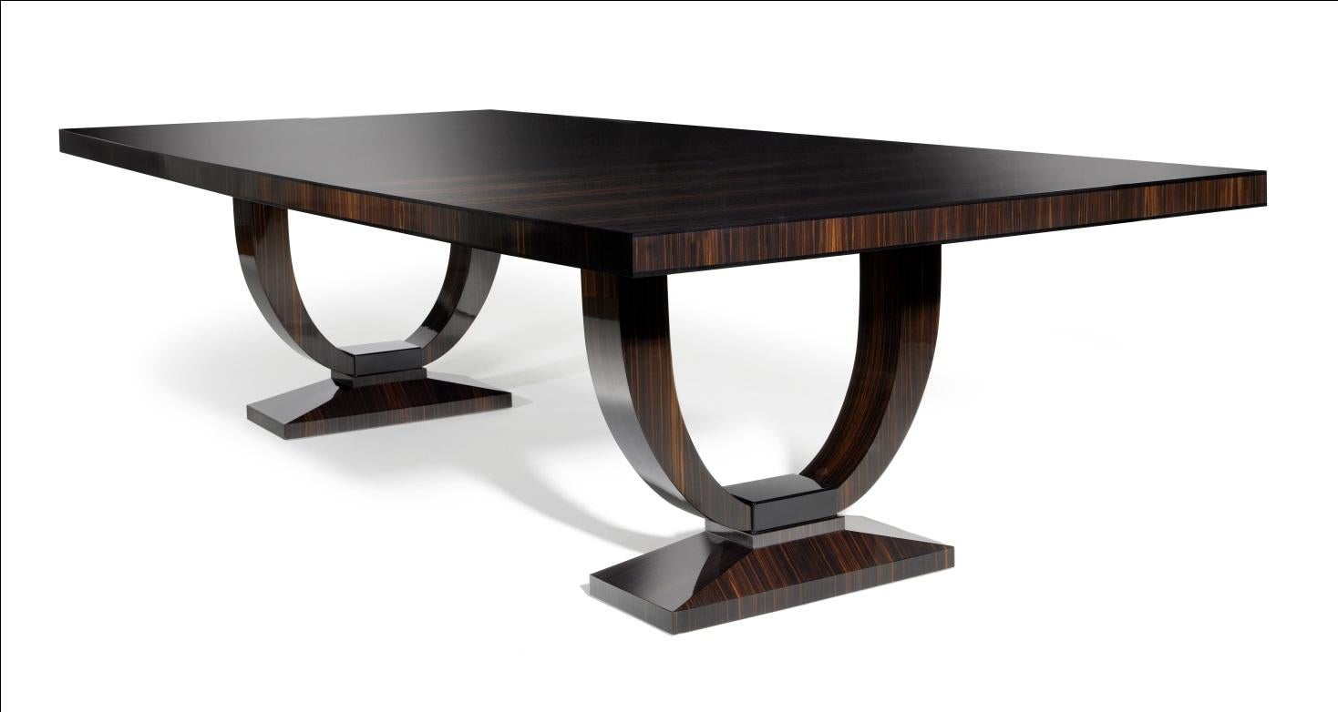 The ultimate Davidson dining table finished in sycamore black with white gold leaf detailing.

The soft, curved shape of the pedestal and width of the frieze is highly influenced by the Art Deco period of the 1920s and 1930s. The table has