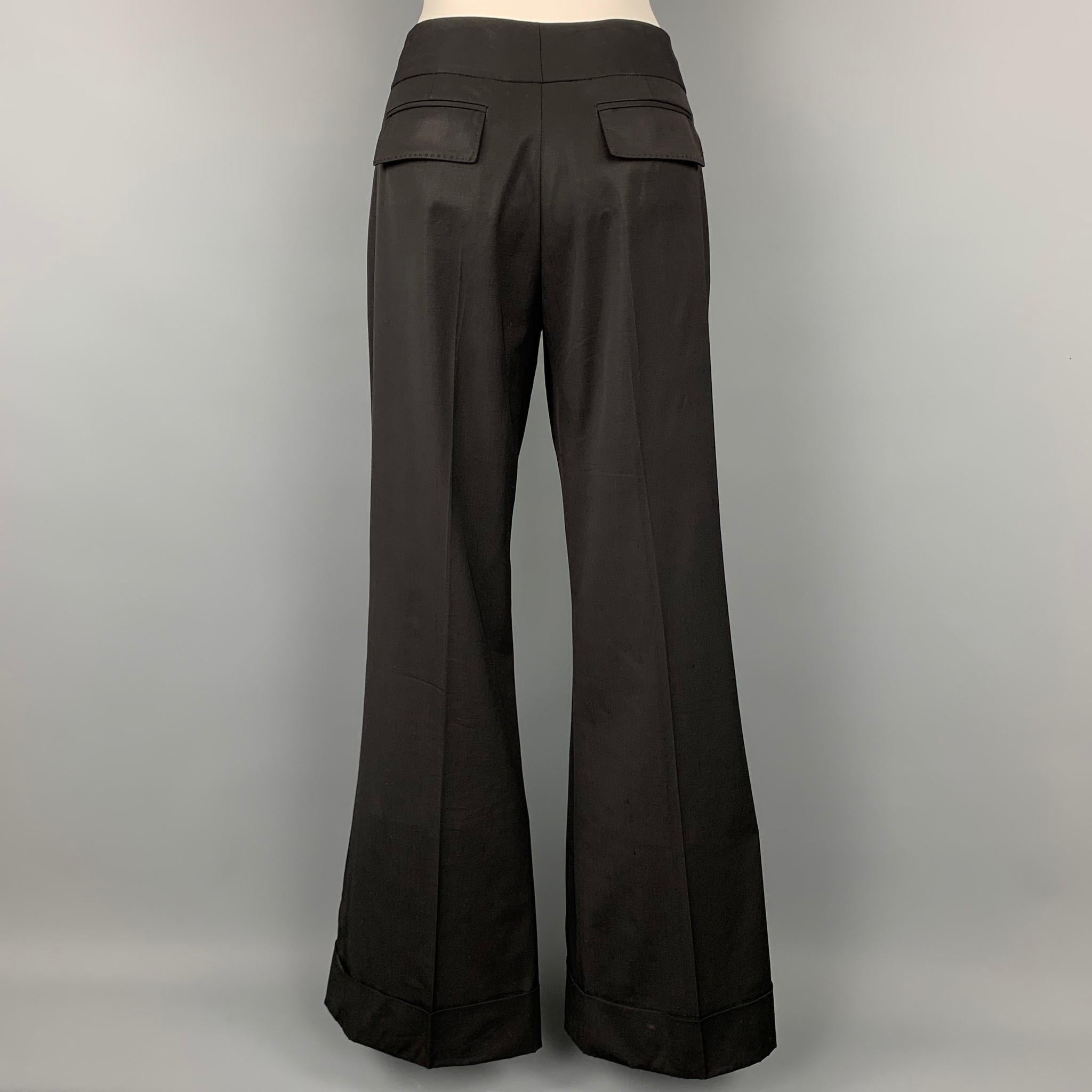 KAUFMAN FRANCO dress pants comes in a black wool featuring a wide leg style, slit pockets, front tab, and a zip fly closure. 

Very Good Pre-Owned Condition.
Marked: No size marked

Measurements:

Waist: 32 in.
Rise: 10 in.
Inseam: 34 in. 