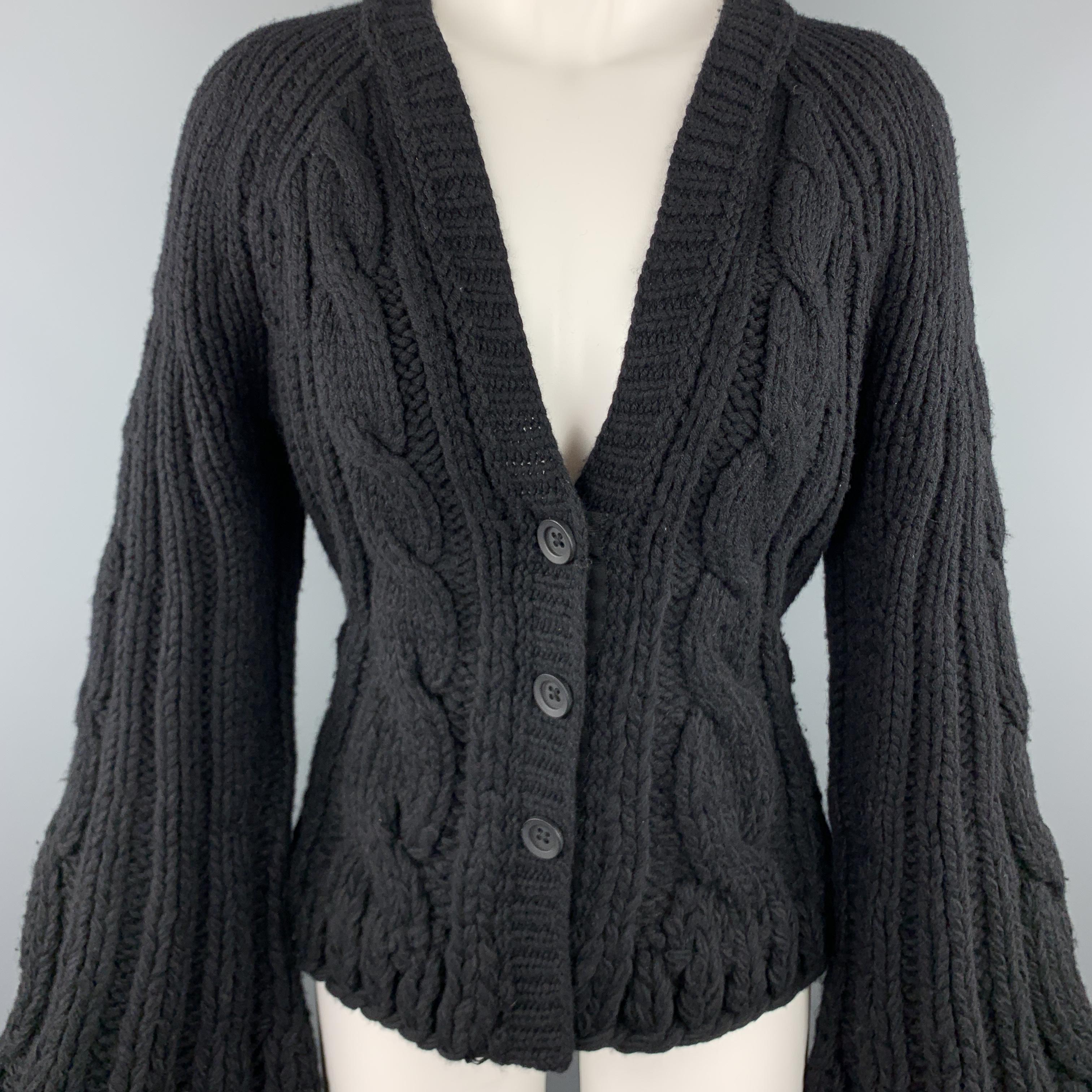 KAUFMAN FRANCO cardigan jacket comes in chunky wool cashmere blend cable knit with a v neck, snap closures, and bell sleeves. Wear throughout. As-is. 

Good Pre-Owned Condition.
Marked: M

Measurements:

Shoulder: 16 in.
Bust: 18 in.
Sleeve: 28