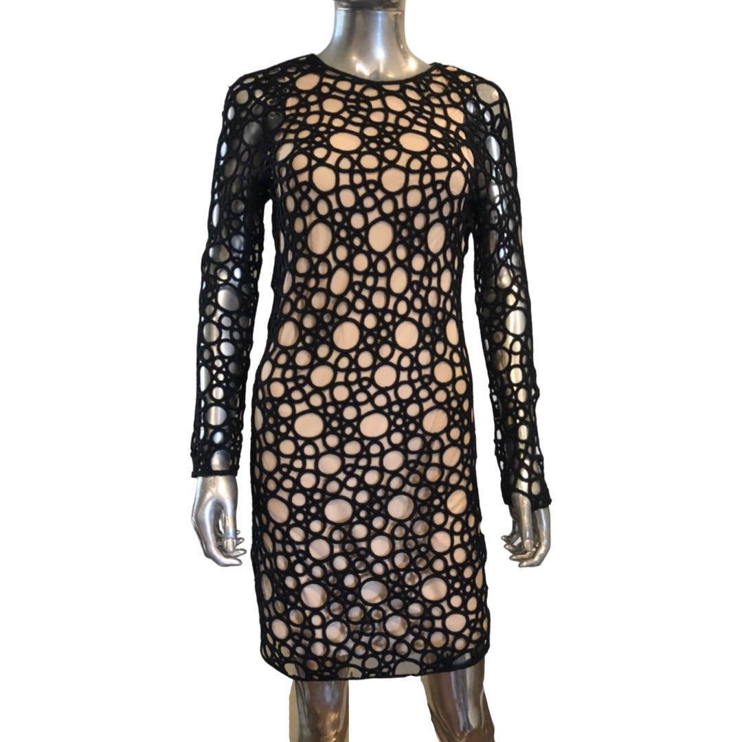 A high end beautiful sheath dress by design duo Kaufmanfranco. A laser cut modern lace with nude lining on bodice of dress. No lining on the long sleeves. Modern exposed back zipper. NWT, this dress was in a fashionista’s Palm Springs closet but