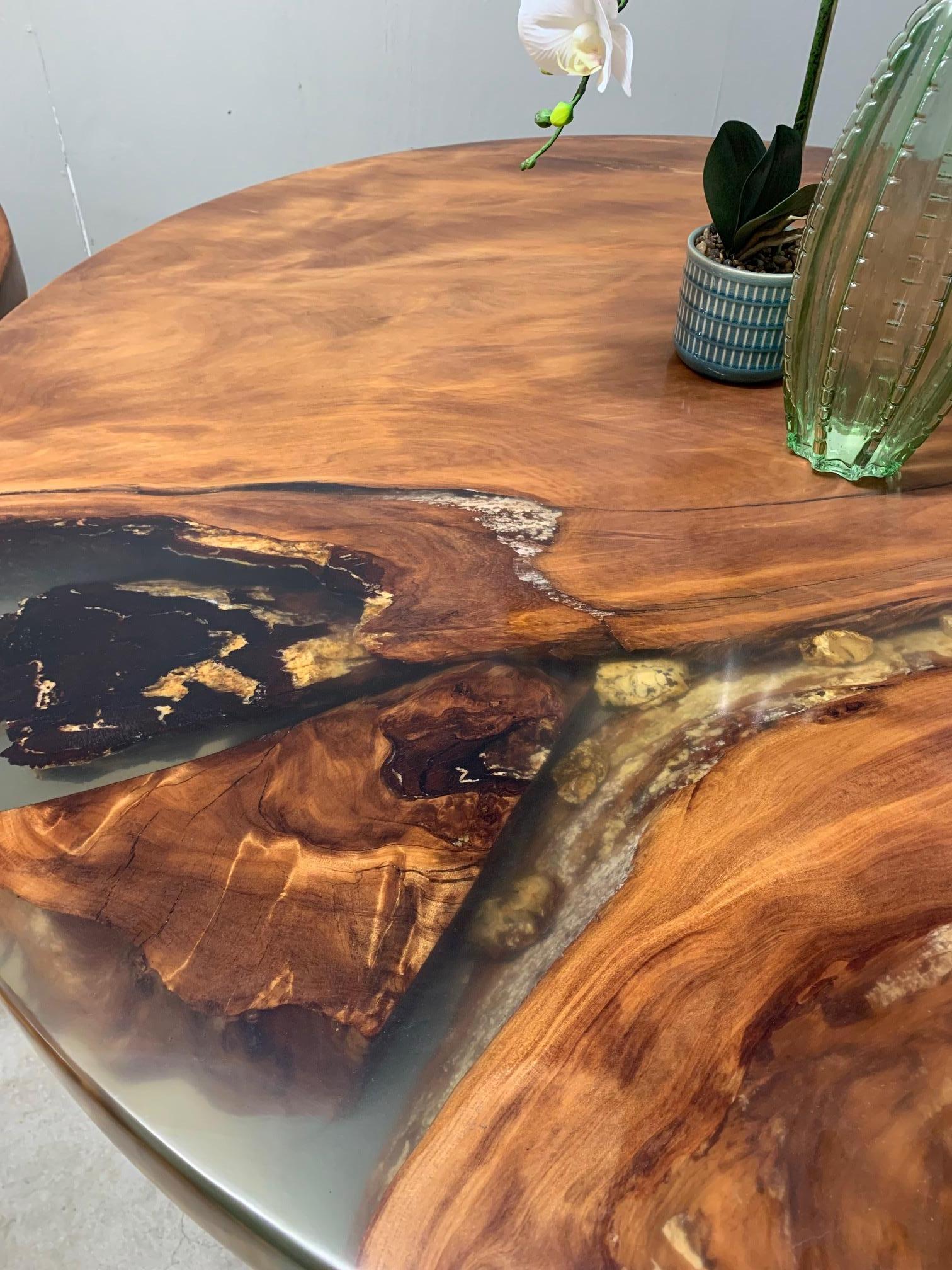 Modern Kauri dining table made from solid Ancient Swamp Kauri wood.

A live edge Kauri dining table made from New Zealand 50,000-year-old Ancient Swamp Kauri. Hand-crafted in Auckland, New Zealand from a single piece of Ancient Swamp Kauri. The