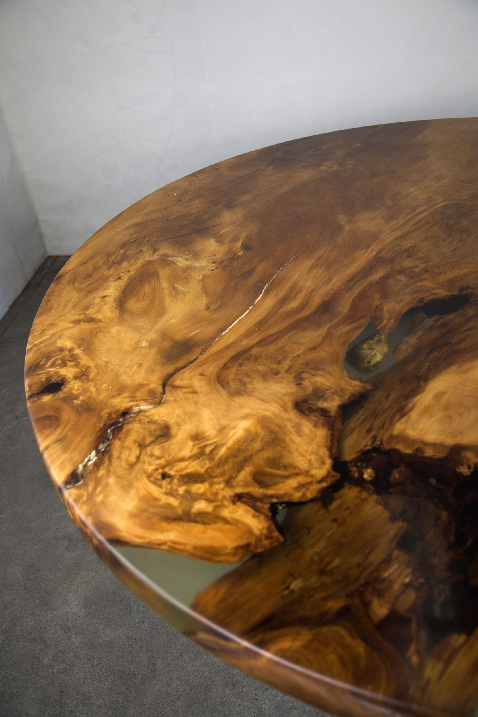 Modern Kauri dining table made from solid Ancient Swamp Kauri wood.

A live edge Kauri dining table made from New Zealand 50,000-year-old Ancient Swamp Kauri. Hand-crafted in Auckland, New Zealand from a single piece of Ancient Swamp Kauri. The