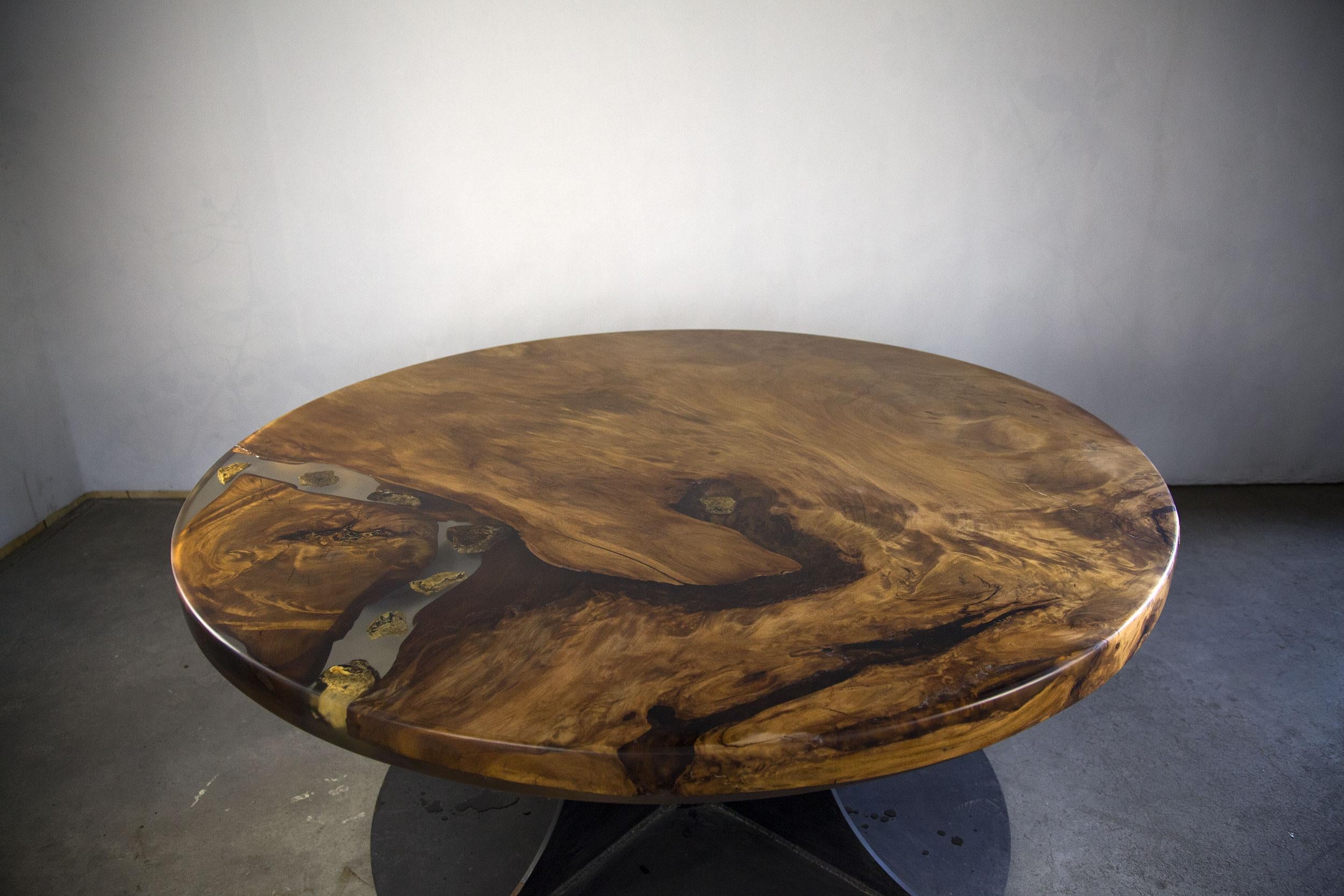 Modern Kauri dining table made from solid Ancient Swamp Kauri wood.

A live edge Kauri dining table made from New Zealand 50,000-year-old Ancient Swamp Kauri. Hand-crafted in Auckland, New Zealand from a single piece of Ancient Swamp Kauri. The