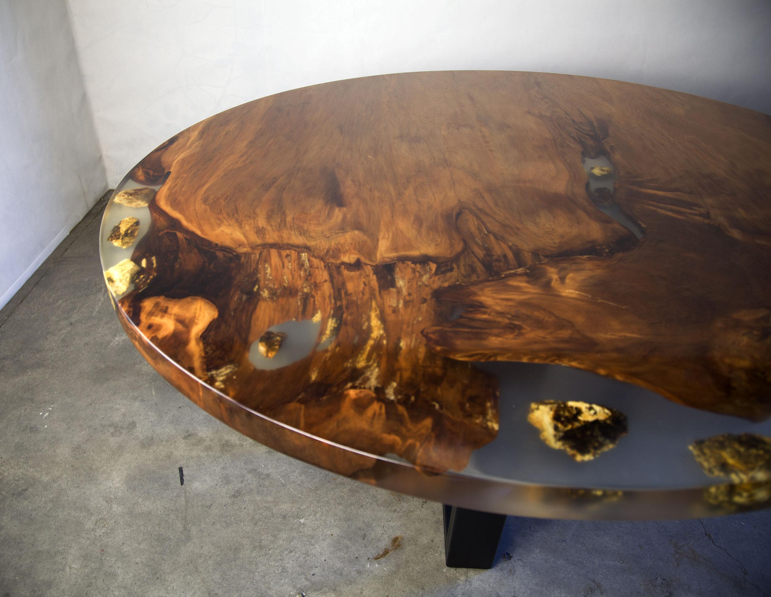 Modern Kauri dining table made from solid ancient swamp kauri wood.

A live edge Kauri dining table made from New Zealand 50,000-year-old Ancient Swamp Kauri. Handcrafted in Auckland, New Zealand from a single piece of Ancient Swamp Kauri. The