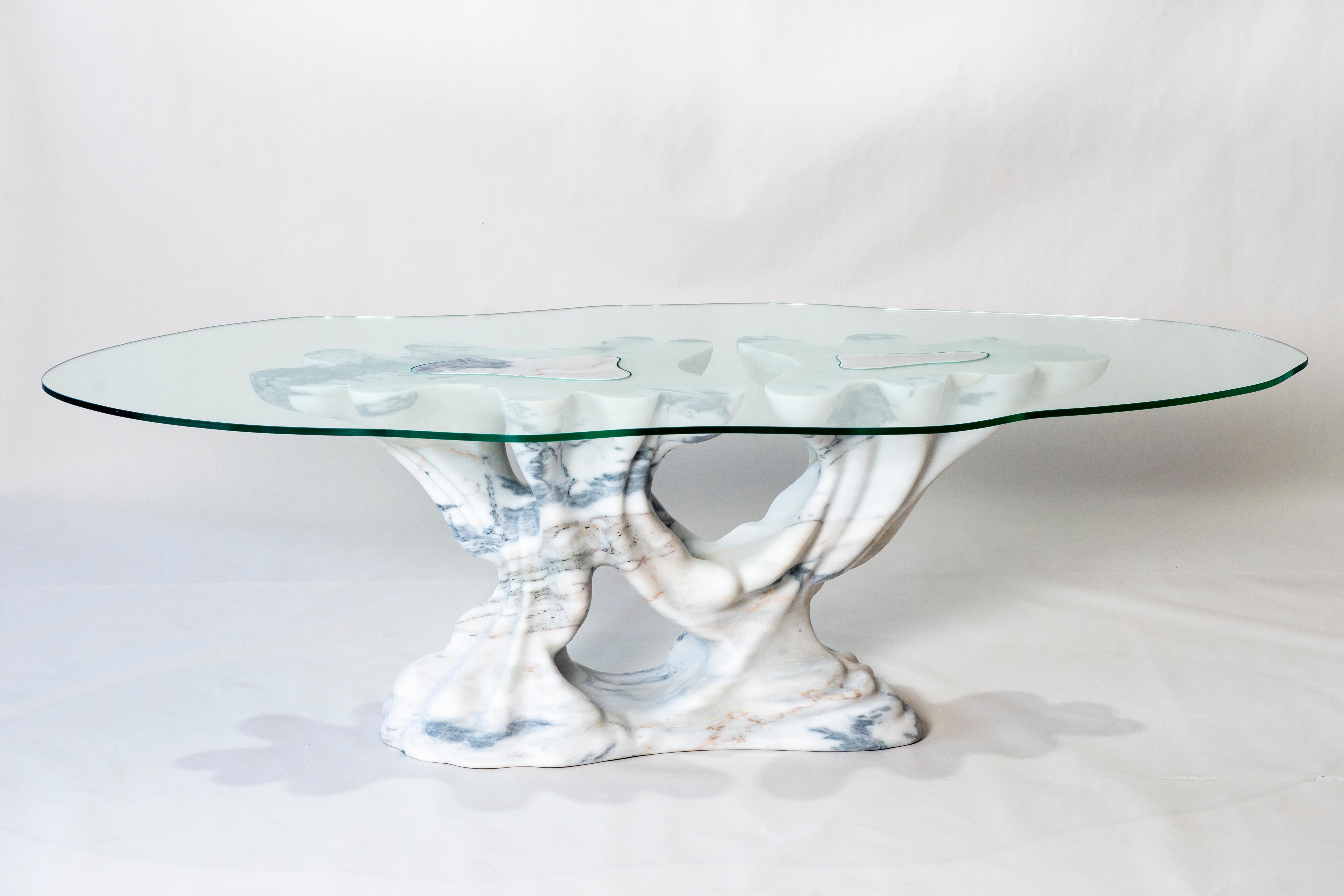Kavachi Dining Table in White Marble & Glass by MANTA Handmade Stone Design
Limited Edition of 6 Pieces.
Dimensions: D 133 x W 258 x H 93 cm. 
Marble base: D 64 x W 177 x H 78 cm.
Glass top: D 133 x W 258 x H 15 cm.
Materials: Marble and