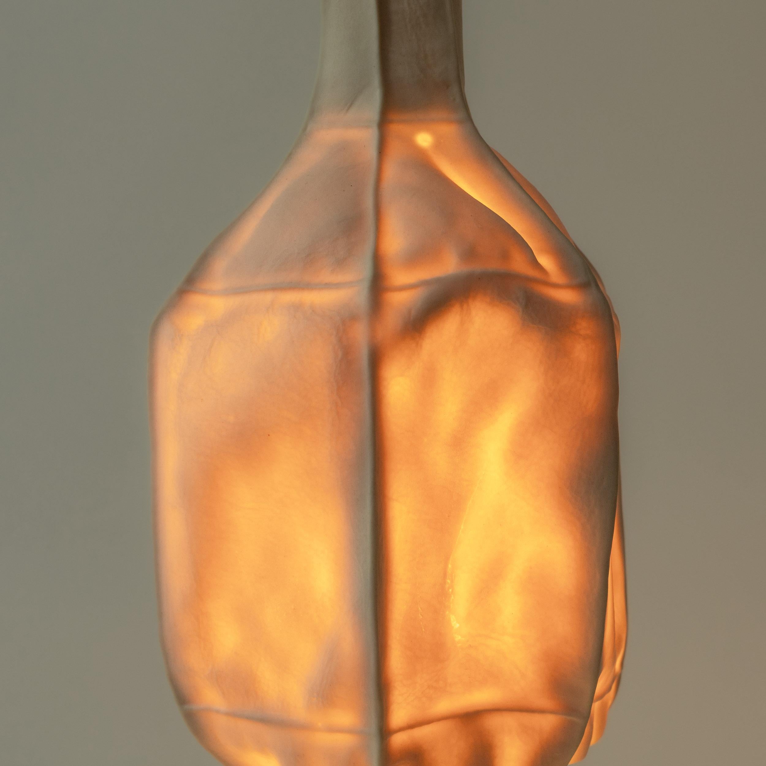 Hand-Crafted Kawa Series Leather-cast porcelain pendant light, white translucent ceramic For Sale