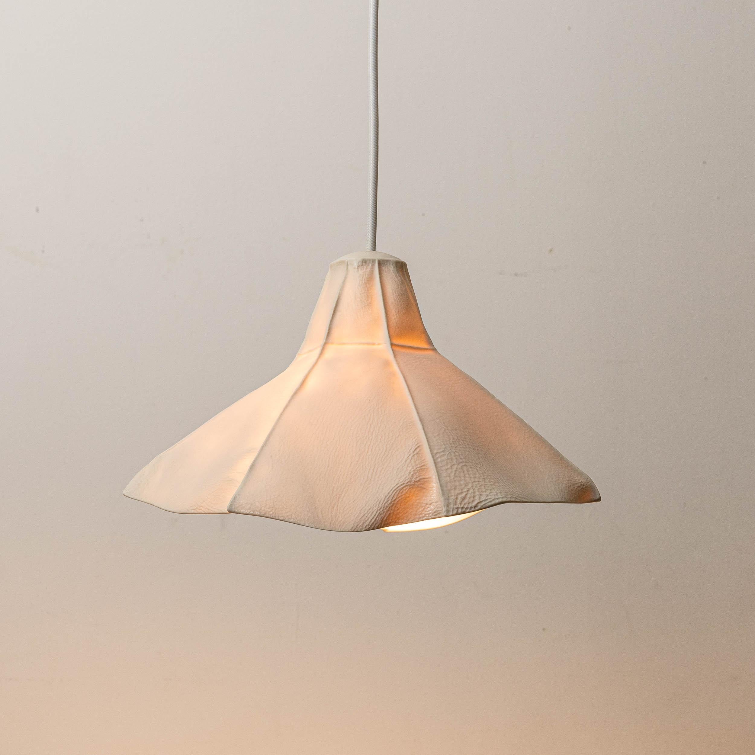 Kawa Series Light 04 Pendant Light by Luft Tanaka Studio

The translucent porcelain diffuser casts a warm colored glow, perfect for a dining room or kitchen. Please inquire about any customization requests including custom shapes, finishes, and