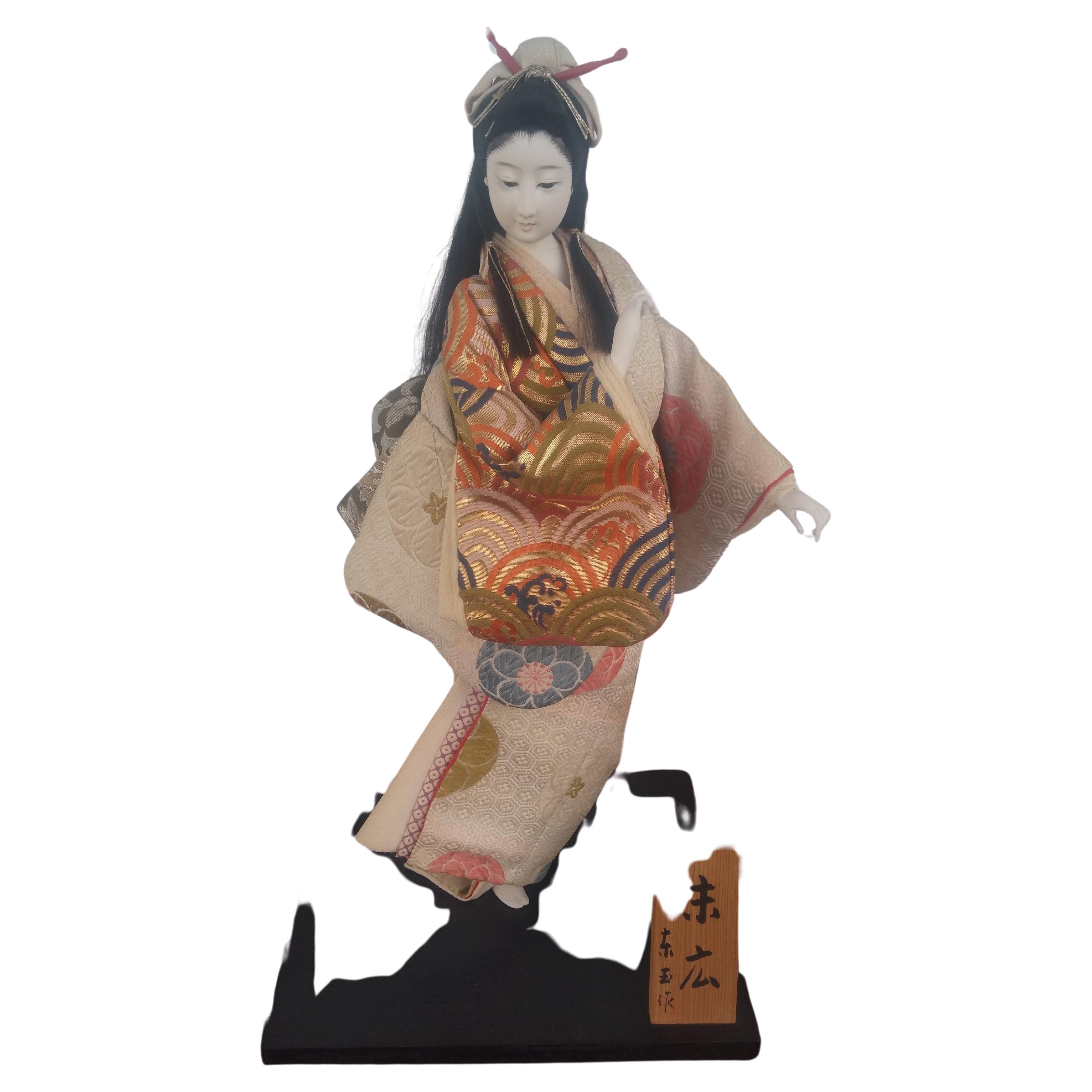 This is a beautiful Geisha girl draped in a beautiful kimono. Her face is made of porcelain. She is wonderfully painted and comes in a lucite display case.

The display case size is
20 x 12.75 x 14