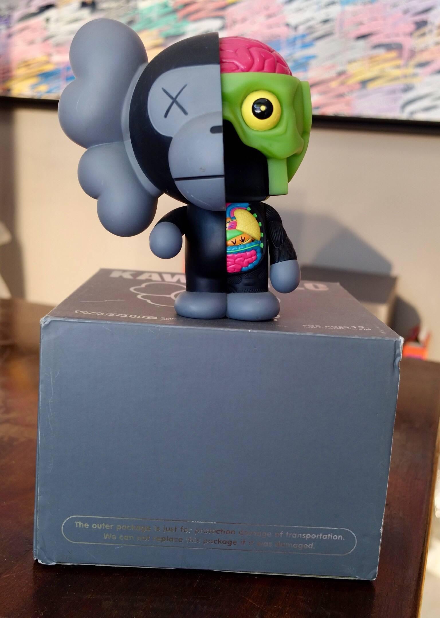 Kaws, Milo, 2011. 

Painted cast vinyl. 
In its original packaging / box. 
Produced and manufactured Medicom Toy, China.

“