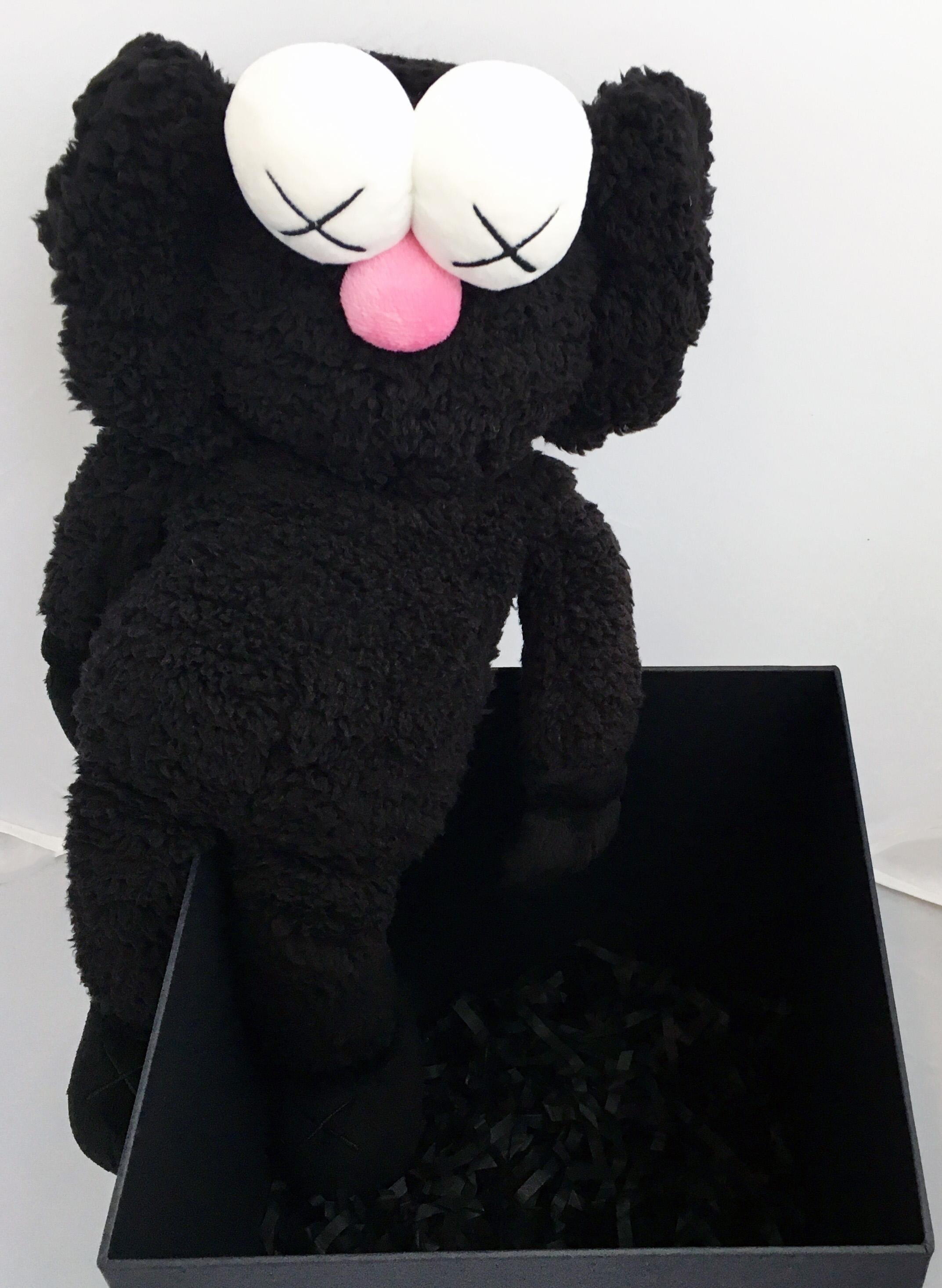 KAWS Black Plush BFF Companion 2016: 
New in its original packaging. Originally created in conjunction with the exhibition, KAWS: Where The End Starts at the Modern Art Museum of Fort Worth (2016). ThIs figurine has since sold out. As only 3,000