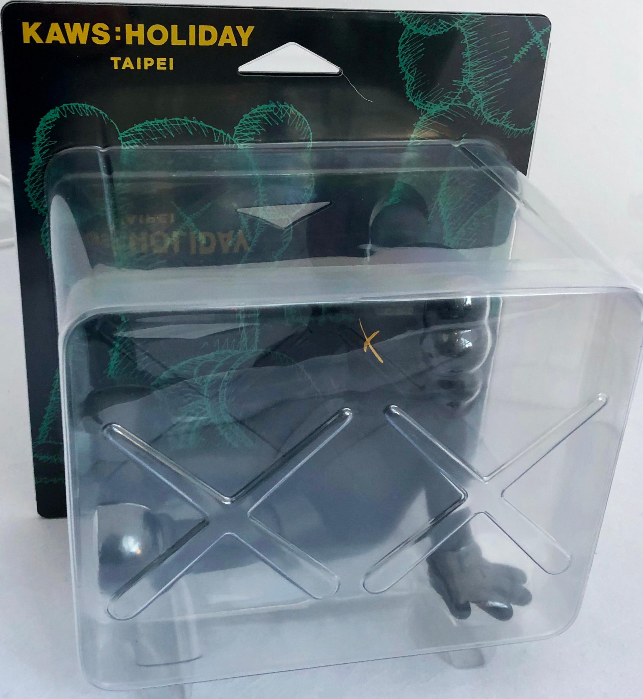 KAWS Black Holiday Companion (KAWS Taipei):
This figure features KAWS' signature character COMPANION in a resting seated position. KAWS Holiday Taipei was published in 2019 to commemorate the debut of KAWS’ largest sculptural endeavor to date: a 36