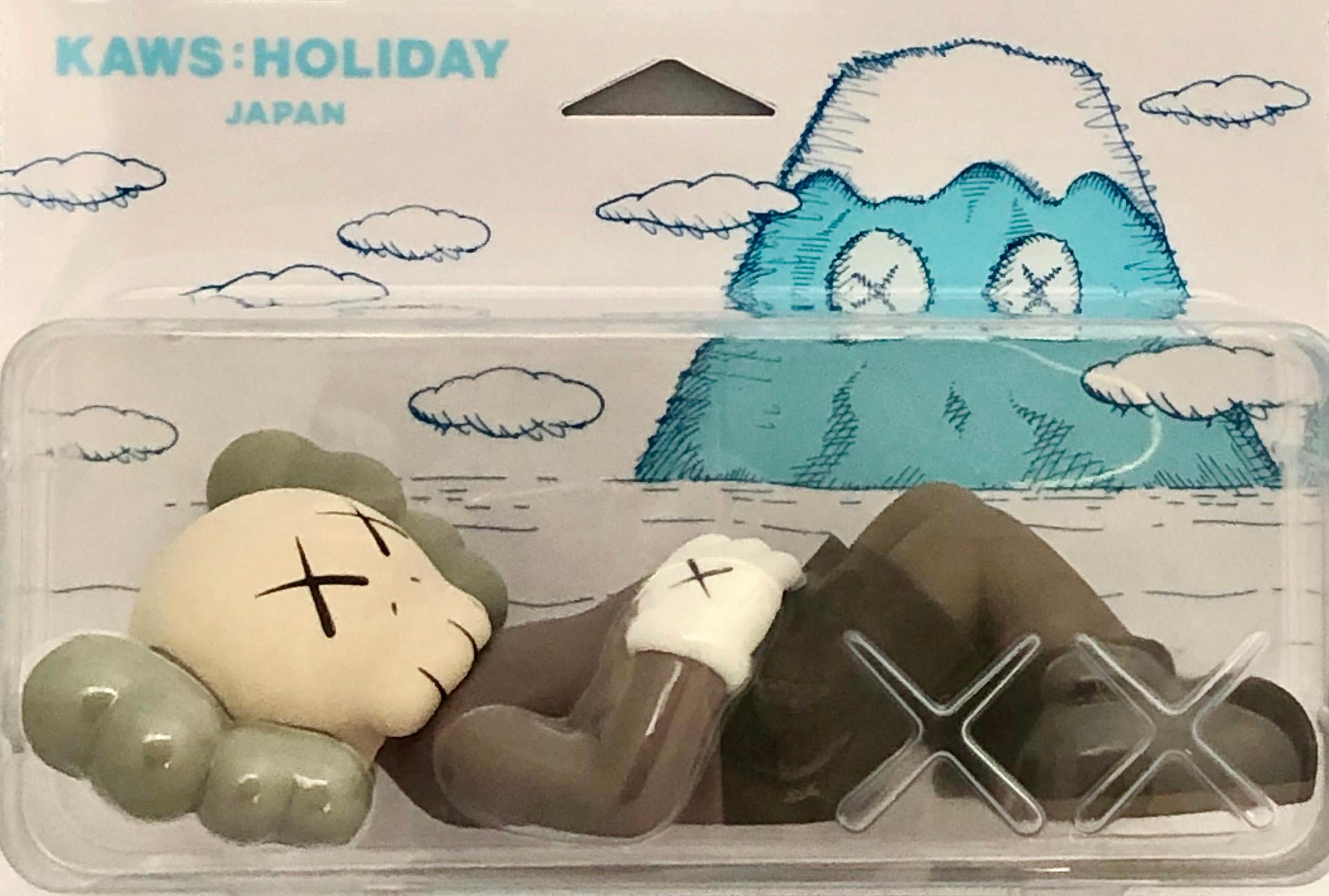KAWS Brown Holiday Companion (KAWS Mount Fuji Japan): 
This sold out figurine features KAWS' signature character COMPANION in a resting position. This figurine was published by All Rights Reserved to commemorate the debut of KAWS’ 40-meters-long