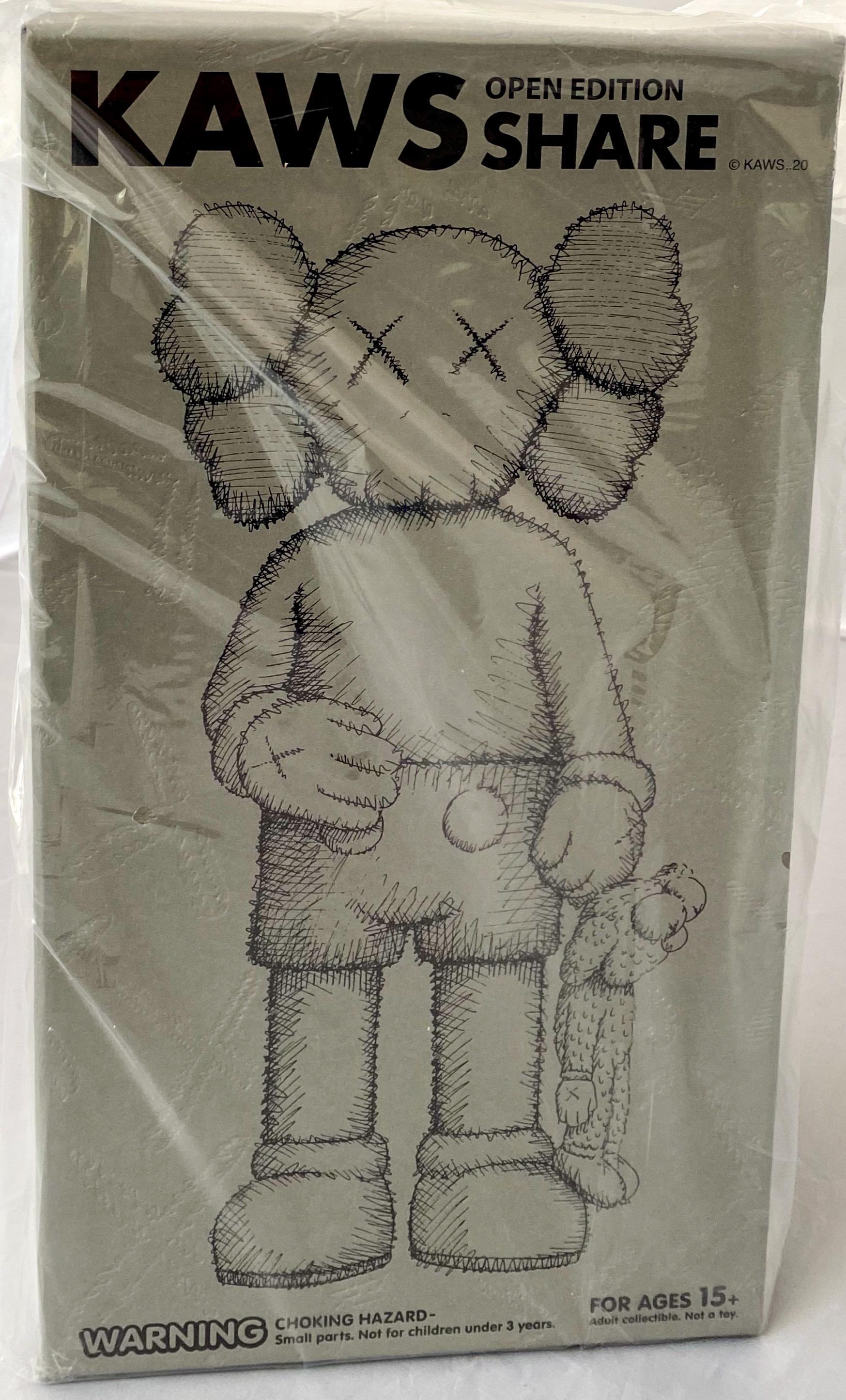 KAWS SHARE (Grey), new & unopened in its original packaging. 
KAWS SHARE first appeared in 'BLACKOUT' – the first London solo exhibition by KAWS (Skarstedt London 2019). In SHARE, KAWS uses two of his characters to convey opposing human attitudes.