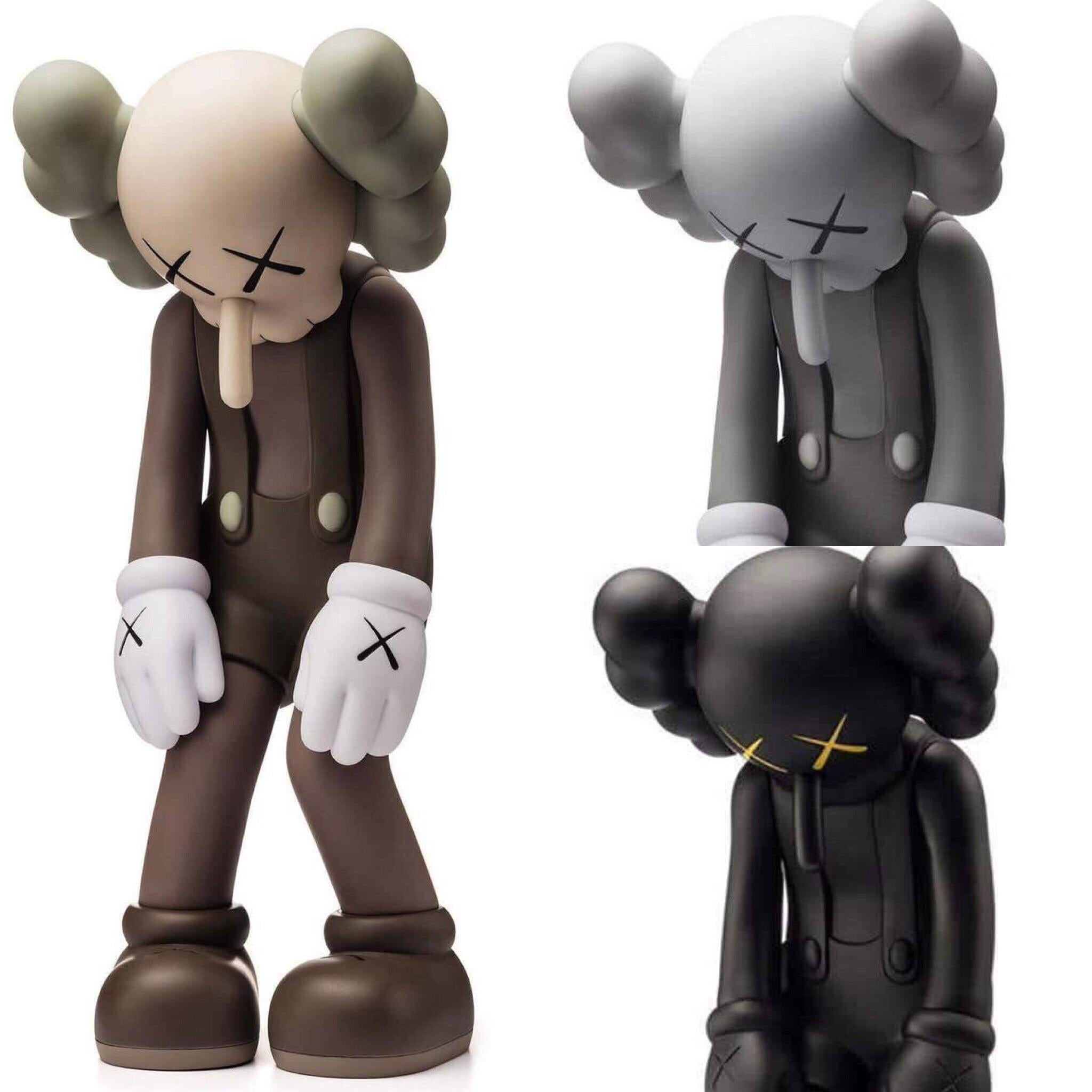 KAWS SMALL LIE: Complete Set of Three. Each new and sealed in their original packaging. These KAWS figurative pieces are a rendition of Small Lie produced in collaboration with Qatar Museums, a 30-feet-tall sculpture constructed out of African