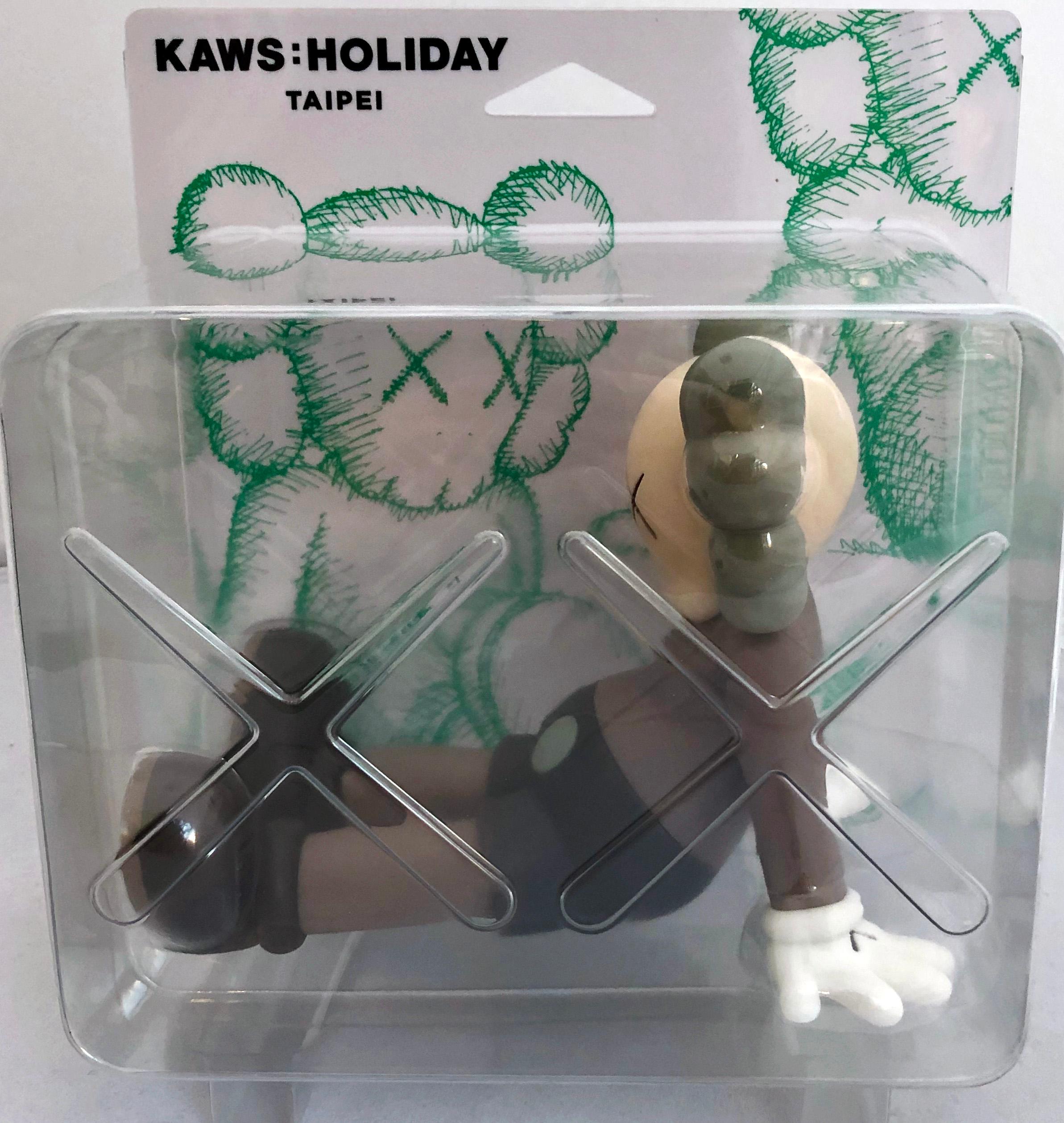 KAWS Taipei Holiday Companion, Set of 2 (KAWS Brown & Grey Companion): 
KAWS' signature character COMPANION presented in a resting seated position. 2 individual pieces (brown, & grey). Each published by All Rights Reserved to commemorate the debut