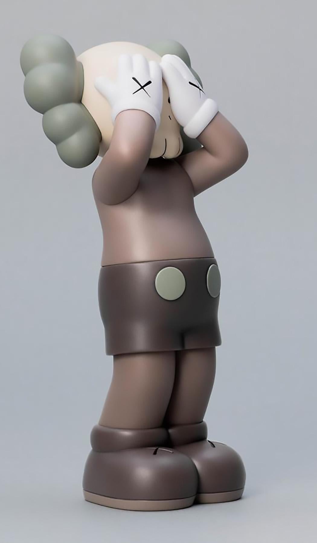KAWS: HOLIDAY United Kingdom Brown (KAWS UK): 
KAWS' signature character COMPANION presented in an upright standing position with its eyes covered. New in their original packaging - published by All Rights Reserved to commemorate the debut of KAWS’