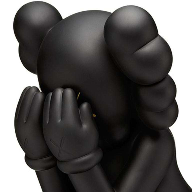 KAWS Companion: Passing Through (Black), 2013. 
Limited edition of 500. 

Medium: Painted cast vinyl. 
Dimensions: 11 x 6.5 x 7.5 in (27.94 x 16.51 x 19.05 cm). 
Stamped on underside of foot. From edition of 500. 
Excellent condition. Figurine only,