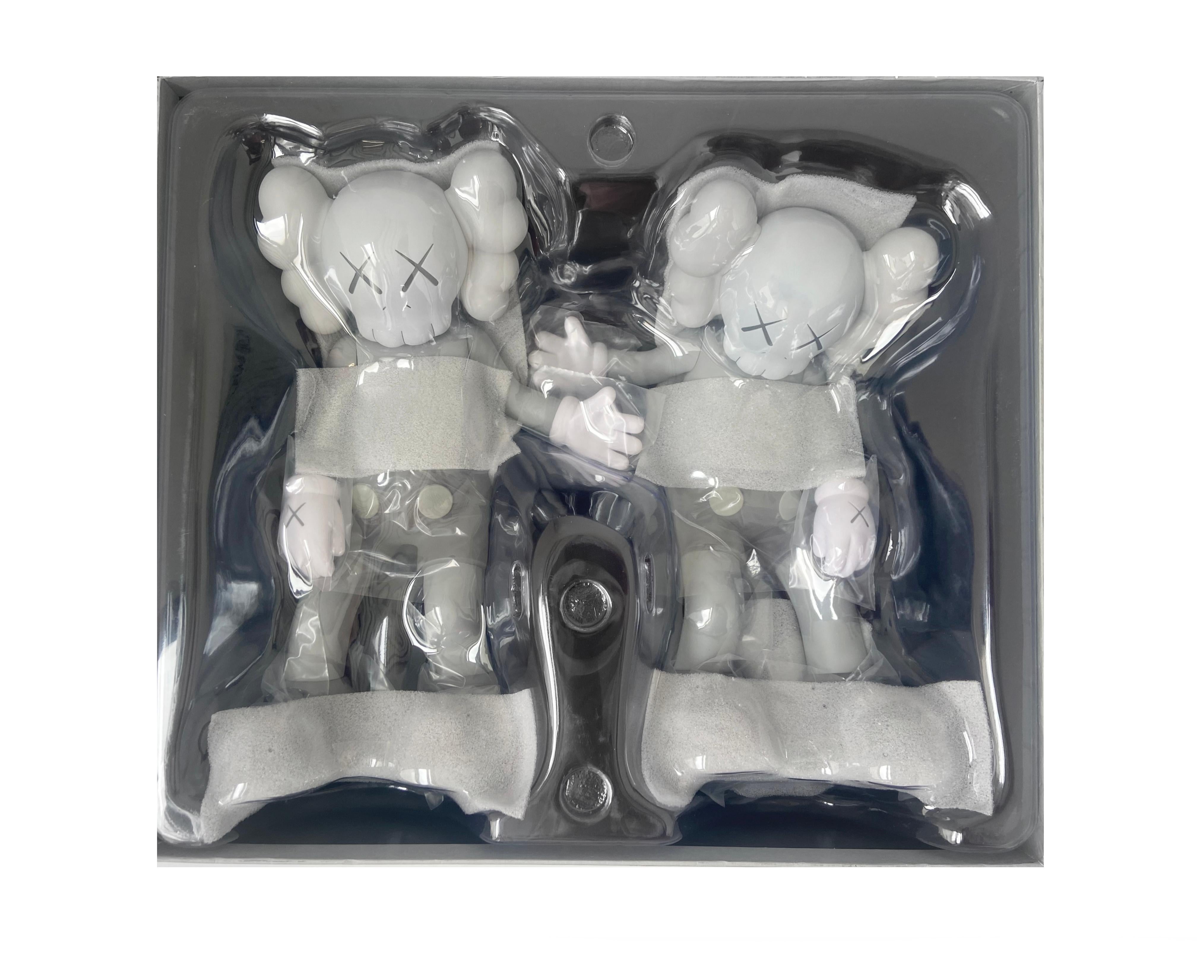 KAWS Along The Way (Grey). New and unopened in its original box. The KAWS Along The Way figurine is a rendition of the artist's 2013 18 foot wood sculpture originally exhibited at Mary Boone gallery New York. The KAWS Along The Way figurine is a