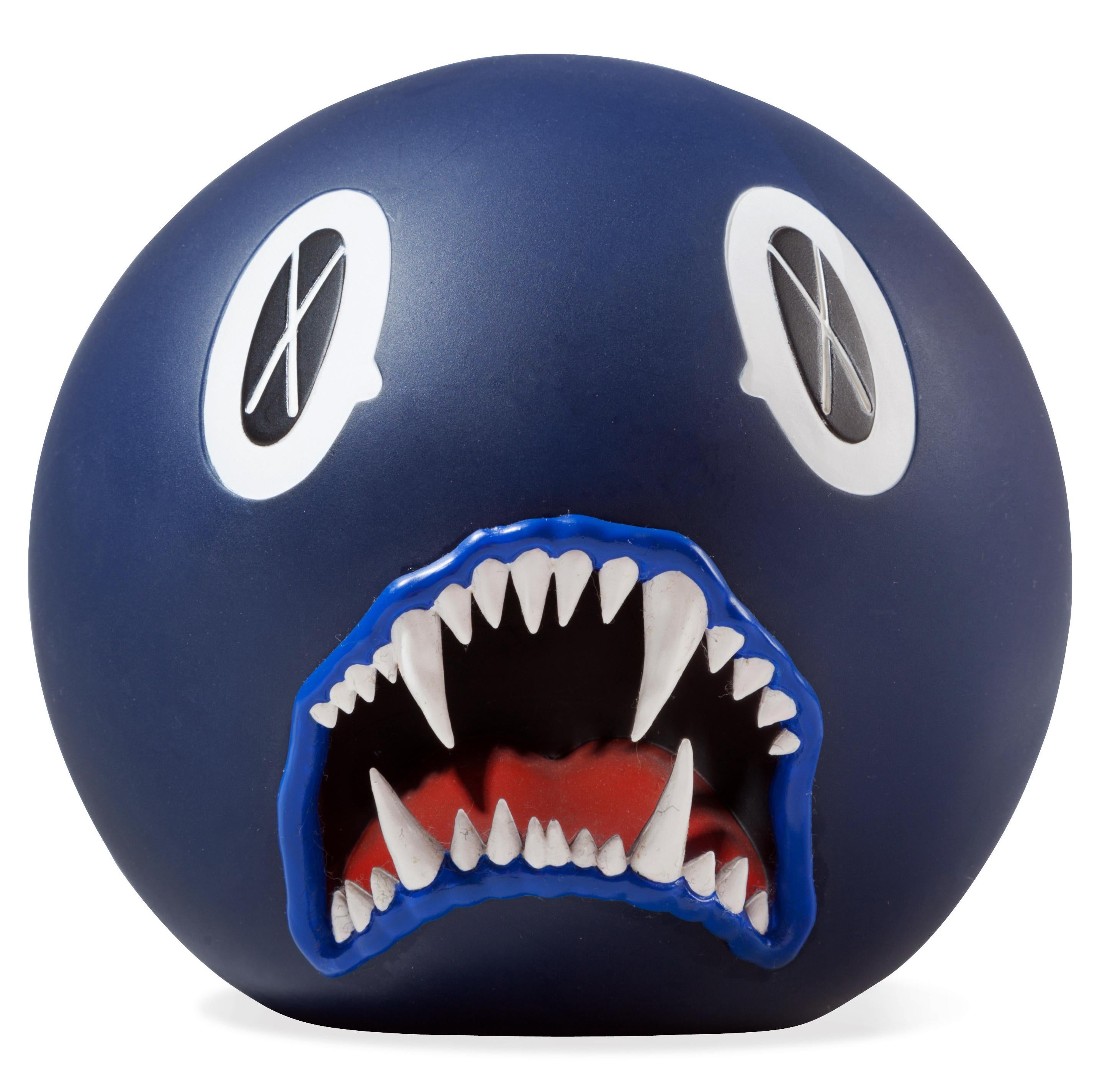 KAWS Cat Teeth Bank (Navy), 2007
"Cat Teeth Bank" was first released in 2007. Subjected to KAWS' signature stylings of an X for each eye, this character maintains a gaping, fanged mouth that can be used to collect change.

Painted cast vinyl. Color: