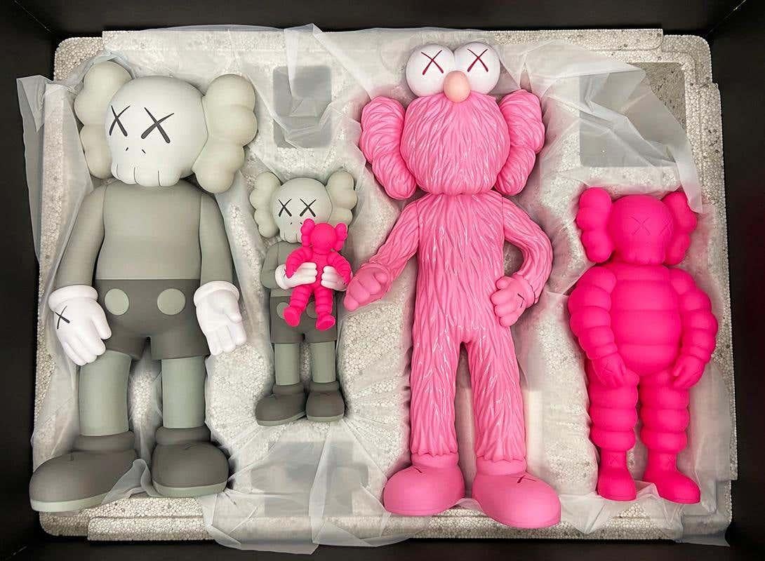 KAWS FAMILY 2021 set of 2 (KAWS FAMILY brown & KAWS FAMILY grey):
A well-received work and variation of KAWS' larger FAMILY sculpture - this highly collectible KAWS Companion set was published on the occasion of KAWS’ first large scale Japanese