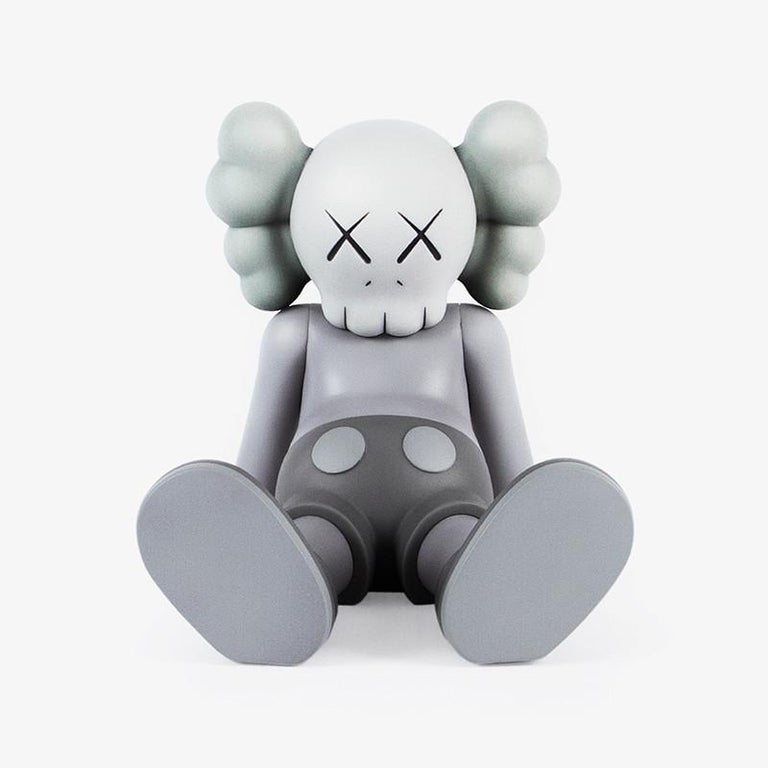 KAWS Grey Holiday Companion (KAWS Taipei) 
This figurine features KAWS' signature character COMPANION in a resting seated position. This figurine was published by All Rights Reserved to commemorate the debut of KAWS’ largest sculptural endeavor to