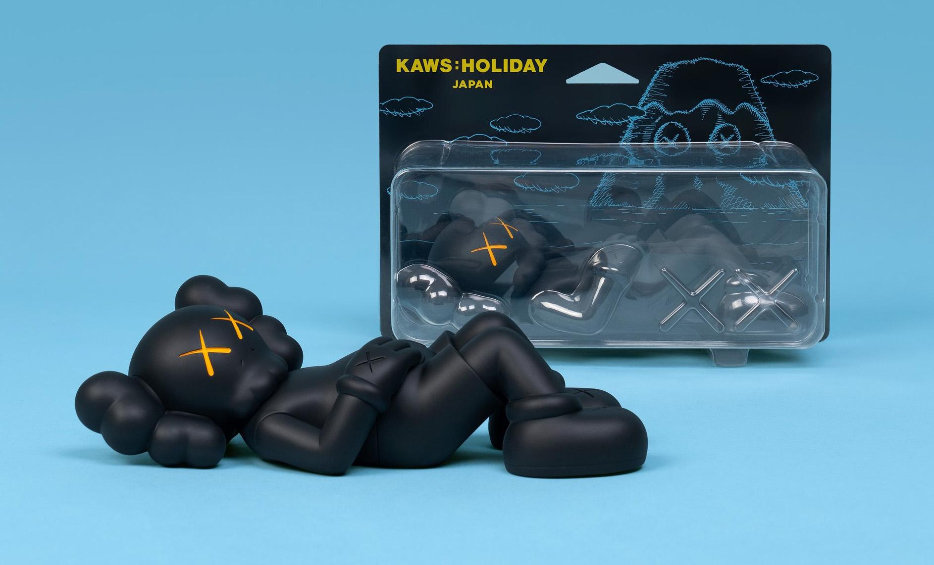 KAWS Black Holiday Companion (KAWS Mount Fuji Japan): 
This figurative vinyl sculpture features KAWS' signature character COMPANION in a resting position. Published by All Rights Reserved to commemorate the debut of KAWS’ 40-meters-long figure
