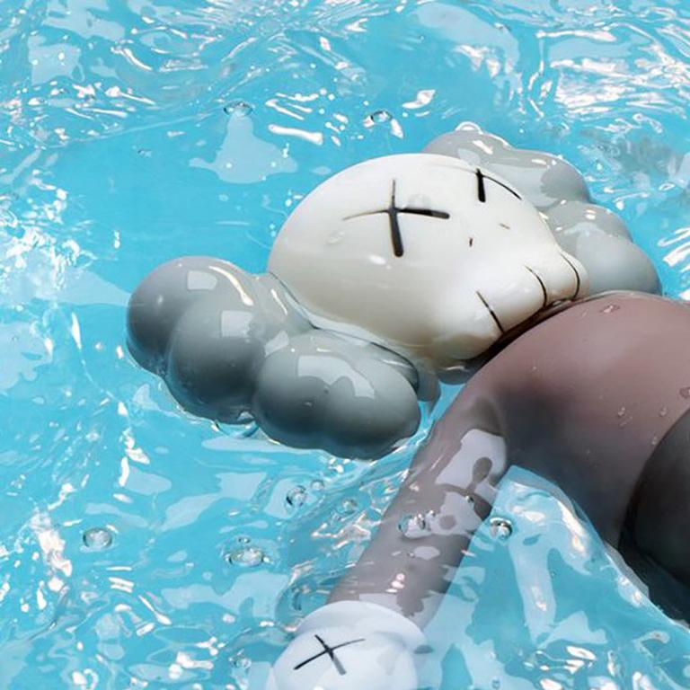 KAWS 'Holiday' Companion:
This figurine was published by All Rights Reserved to commemorate the debut of a large scale KAWS floating figure for Seoul’s Seokchon Lake during summer 2018. New in its original packaging. 

Medium: Vinyl
Year: