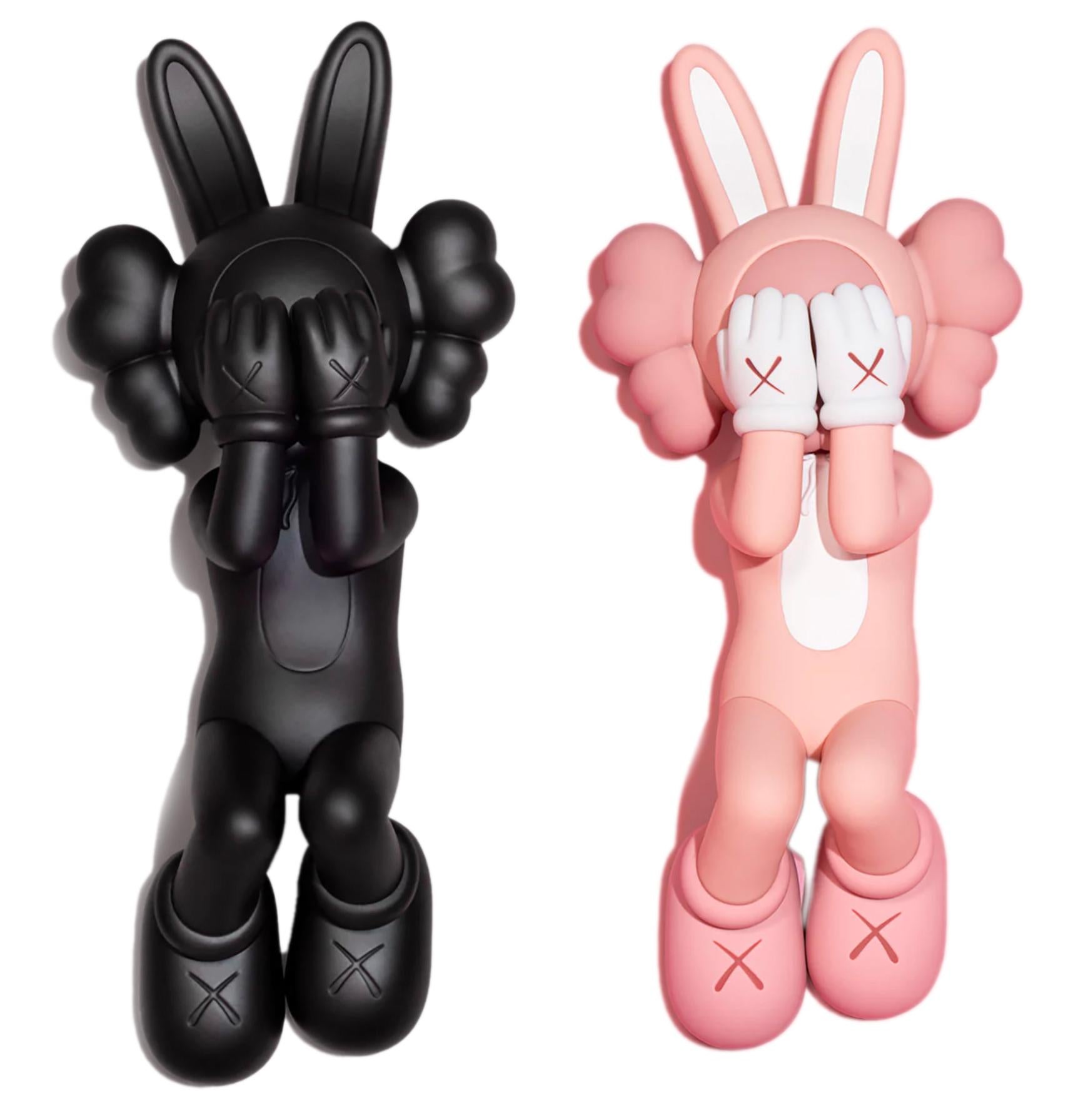 KAWS Holiday Indonesia: complete set of 2 works (KAWS Indonesia):
These figurative vinyl sculptures feature KAWS' Accomplice character in a resting position; published on the occasion of KAWS’ 45 meter version, exhibited at Indonesia's UNESCO World