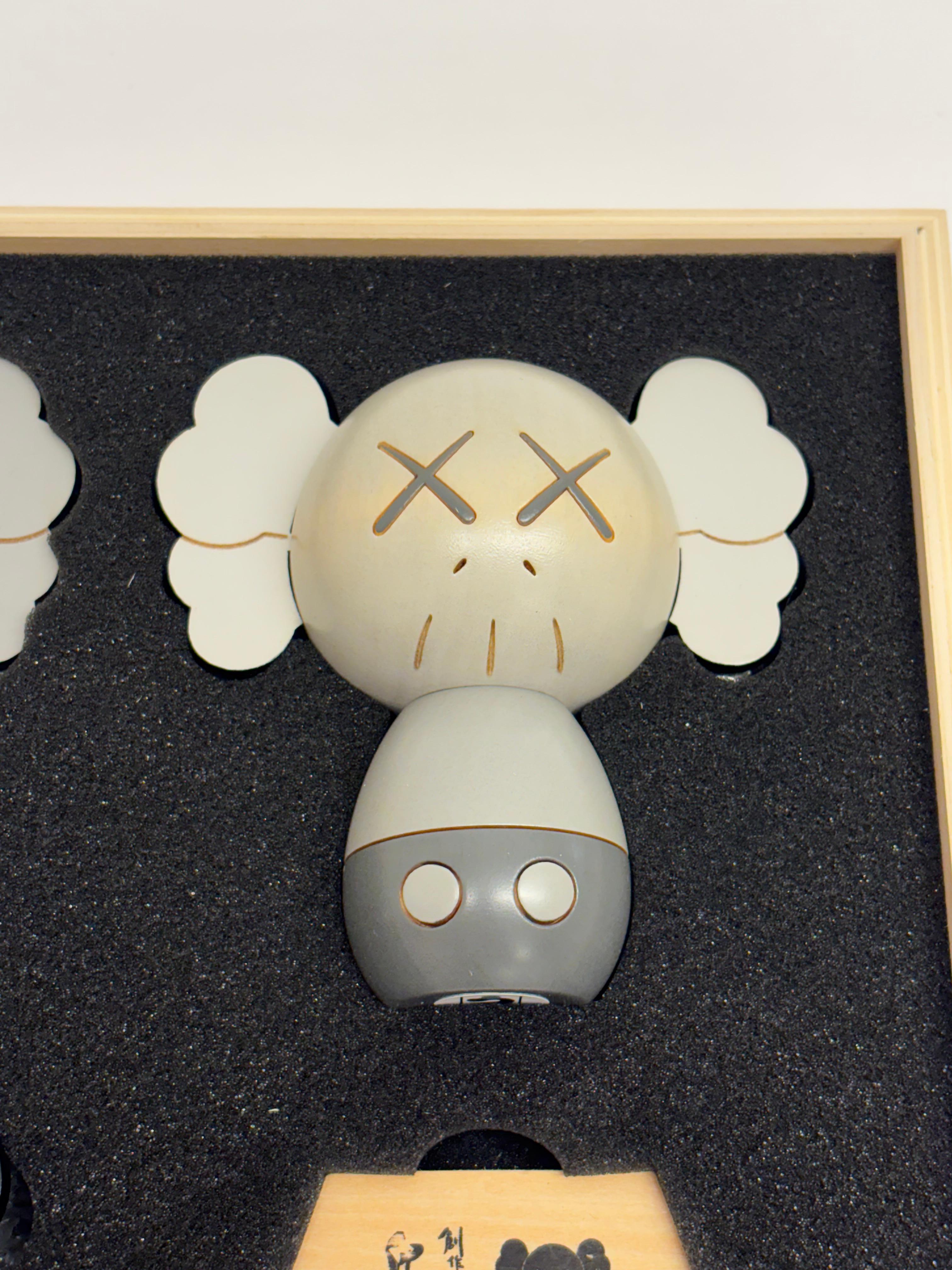 KAWS Holiday Japan Kokeshi wood (set of 3 works) For Sale 7