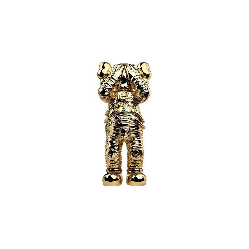 kaws gold statue