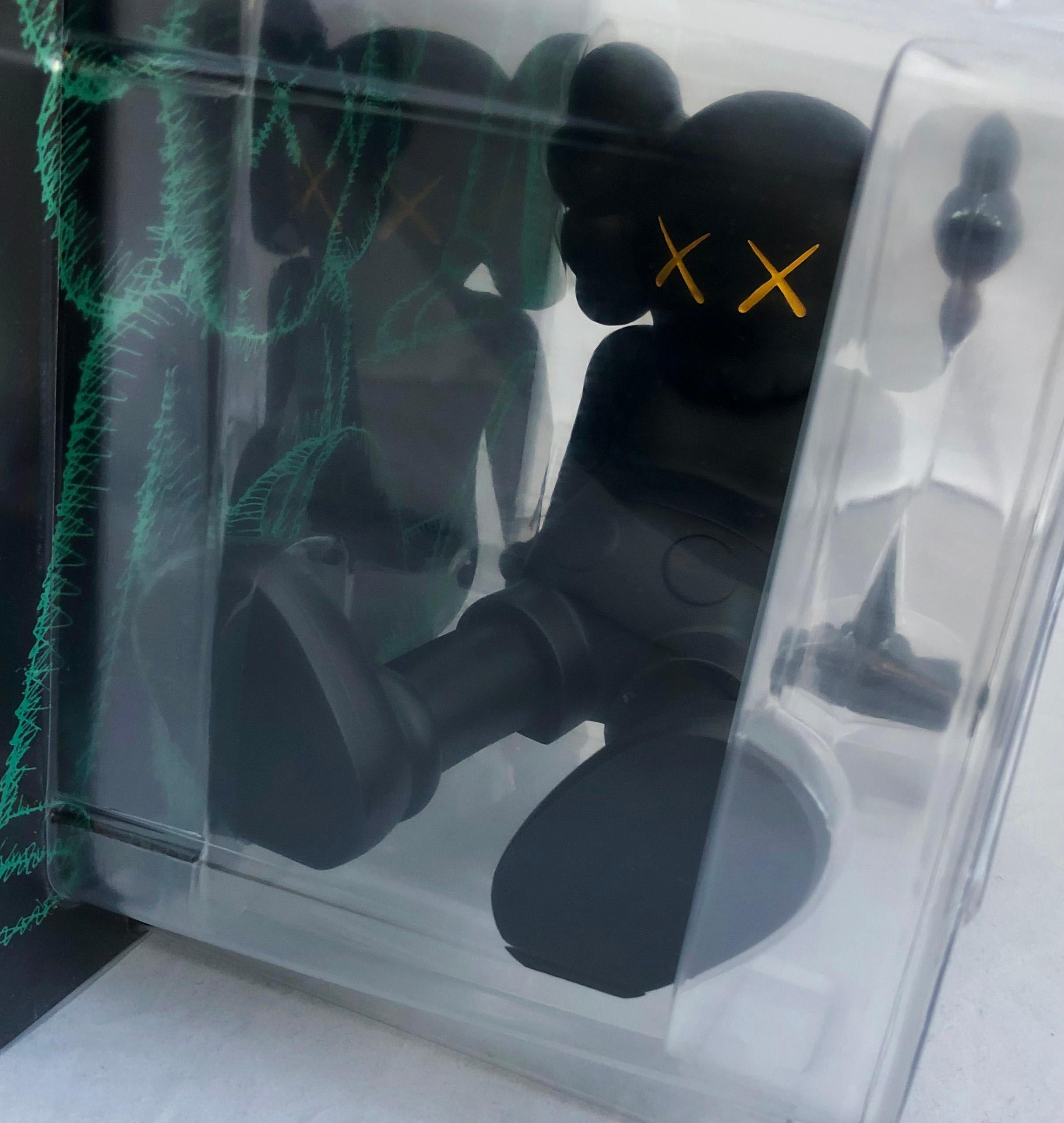 KAWS Black Holiday Companion (KAWS Taipei) 
This figurative vinyl sculpture features KAWS' signature character COMPANION in a resting seated position. Published by All Rights Reserved to commemorate the debut of KAWS’ largest sculptural endeavor to