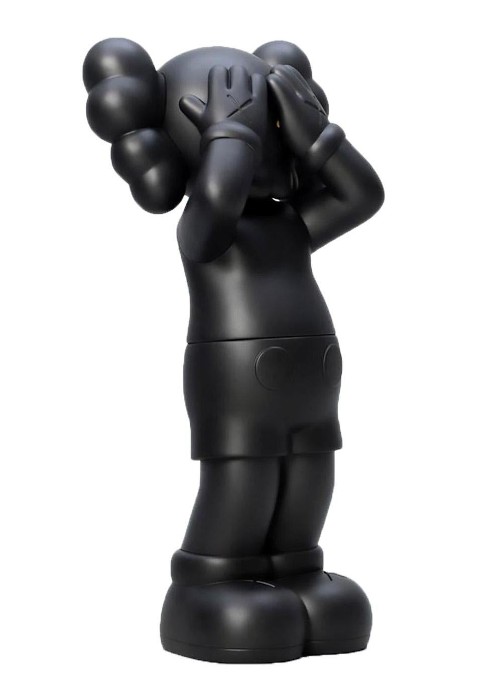 KAWS: HOLIDAY United Kingdom Black (KAWS UK): 
KAWS' signature character COMPANION presented in an upright standing position with its eyes covered. New in their original packaging - published by All Rights Reserved to commemorate the debut of KAWS’