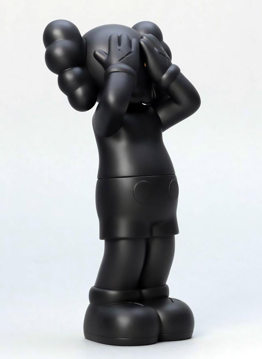 KAWS: HOLIDAY United Kingdom: Set of 2 works (KAWS UK): 
KAWS' signature character COMPANION presented in an upright standing position with its eyes covered. 2 individual works (black & grey), each new in their original packaging - published by All