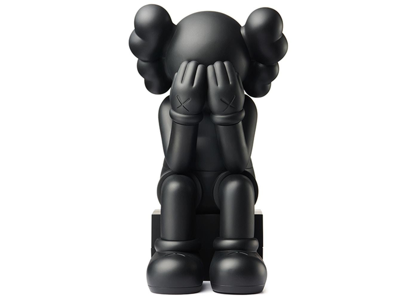 KAWS Black Companion Passing Through 2018. Black colorway. New in its original packaging. 
The most iconic of the KAWS Companions. This classic black KAWS Companion quickly sold out upon its 2018 release and is growing more and more scarce.