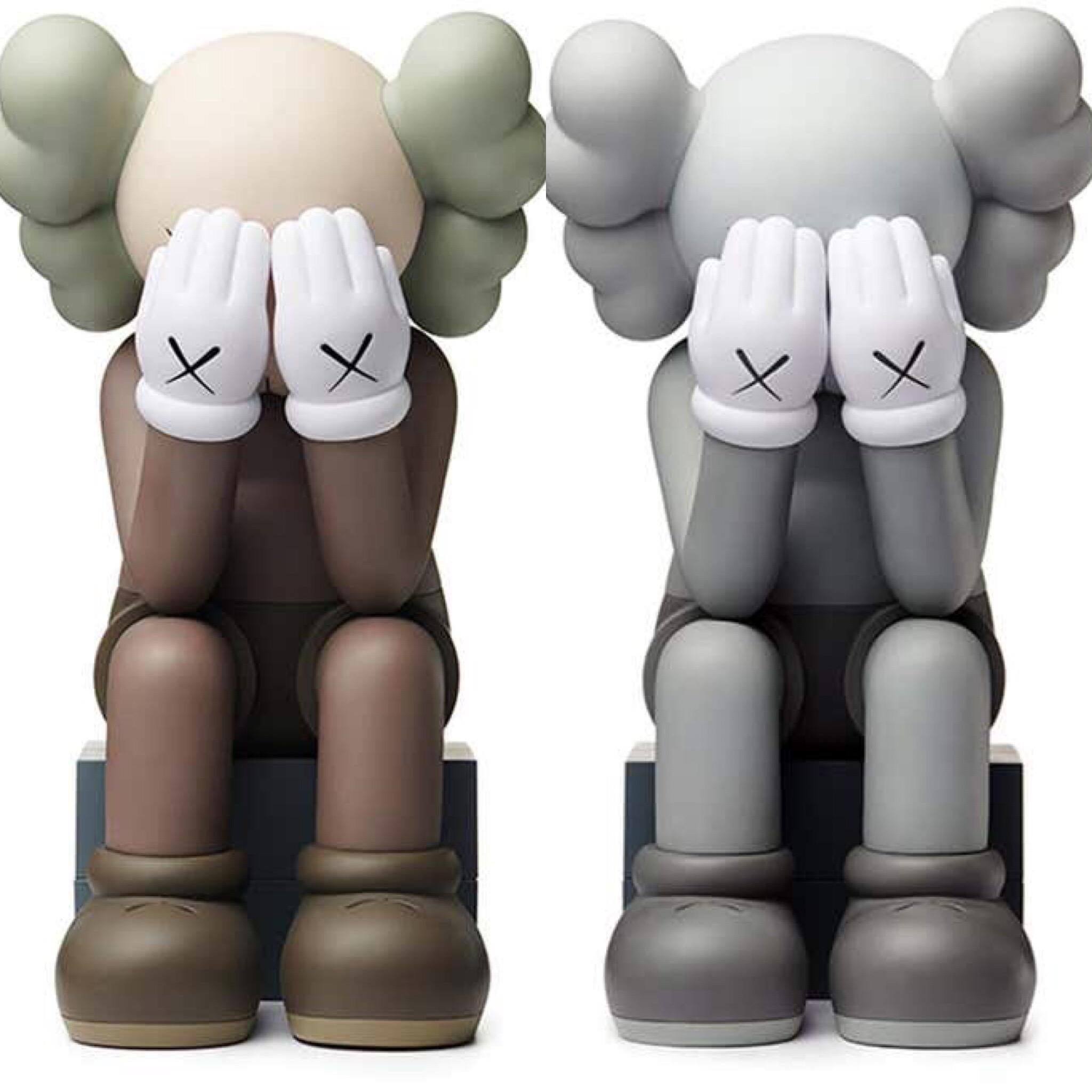 KAWS Companion Passing Through Complete Set of 2 (2018):
The most iconic of the KAWS Companions presented in 2 color-ways: Brown & Grey. Published by KAWS One, these figurines have since sold out. 

Medium: Vinyl, Cast Resin
Dimensions (applies to